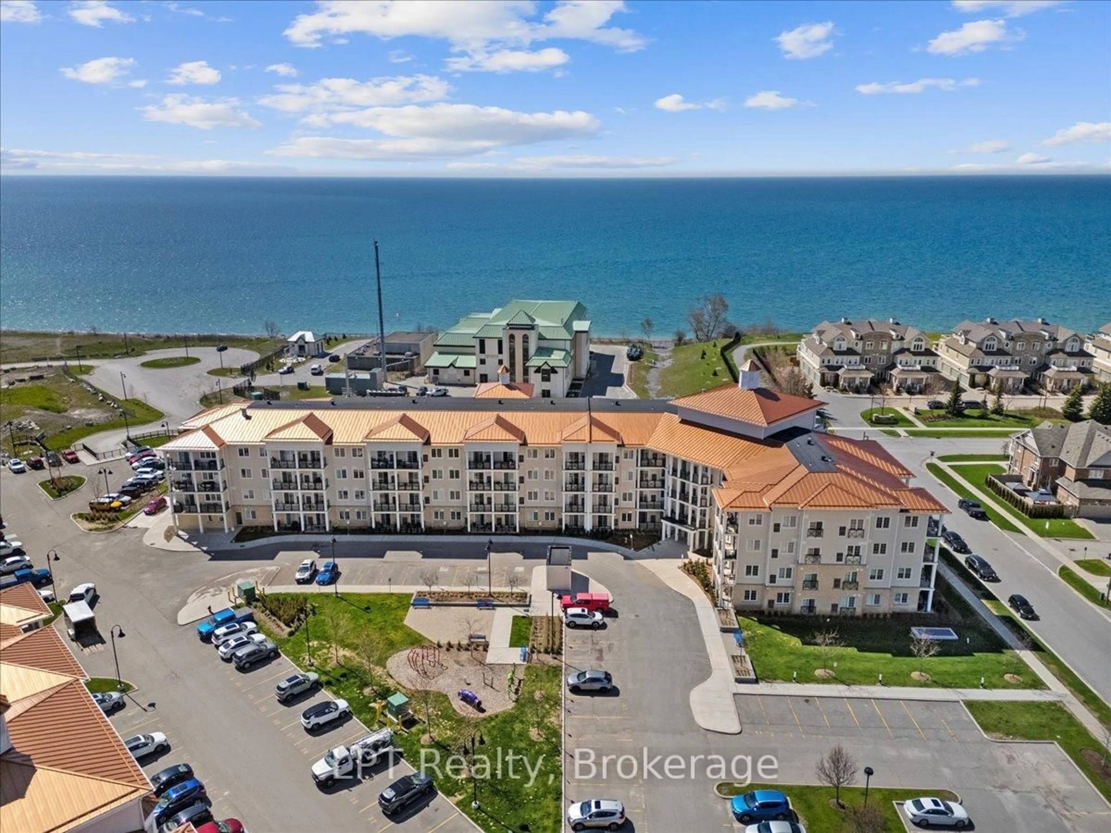 A pic from outside/outdoor area/front of a property/back of a property/a pic from drone, water/lake/river/ocean view for 50 Lakebreeze Dr #102, Clarington Ontario L1B 0V9