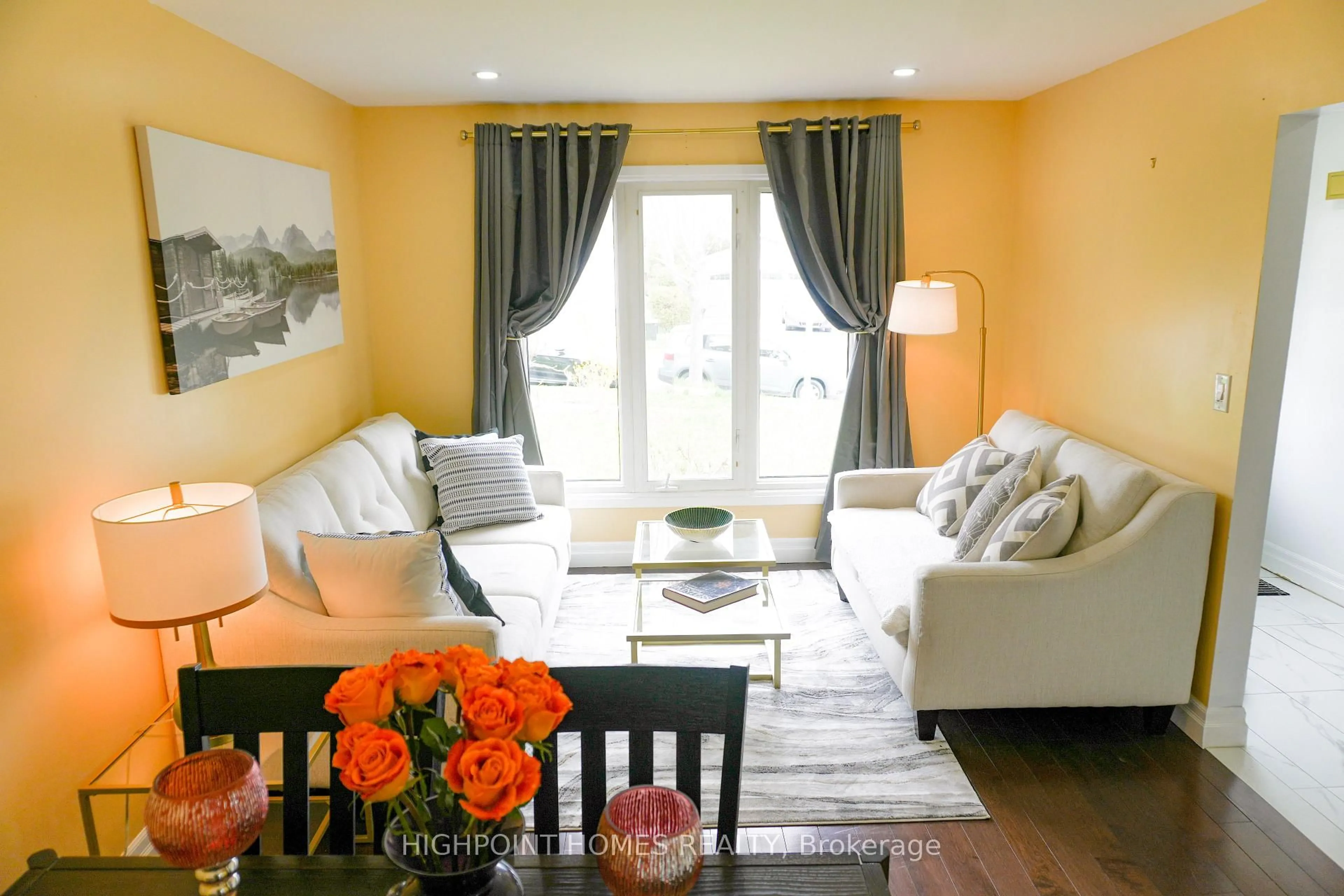 Living room with furniture, wood/laminate floor for 522 Powell Rd, Whitby Ontario L1N 6Y7