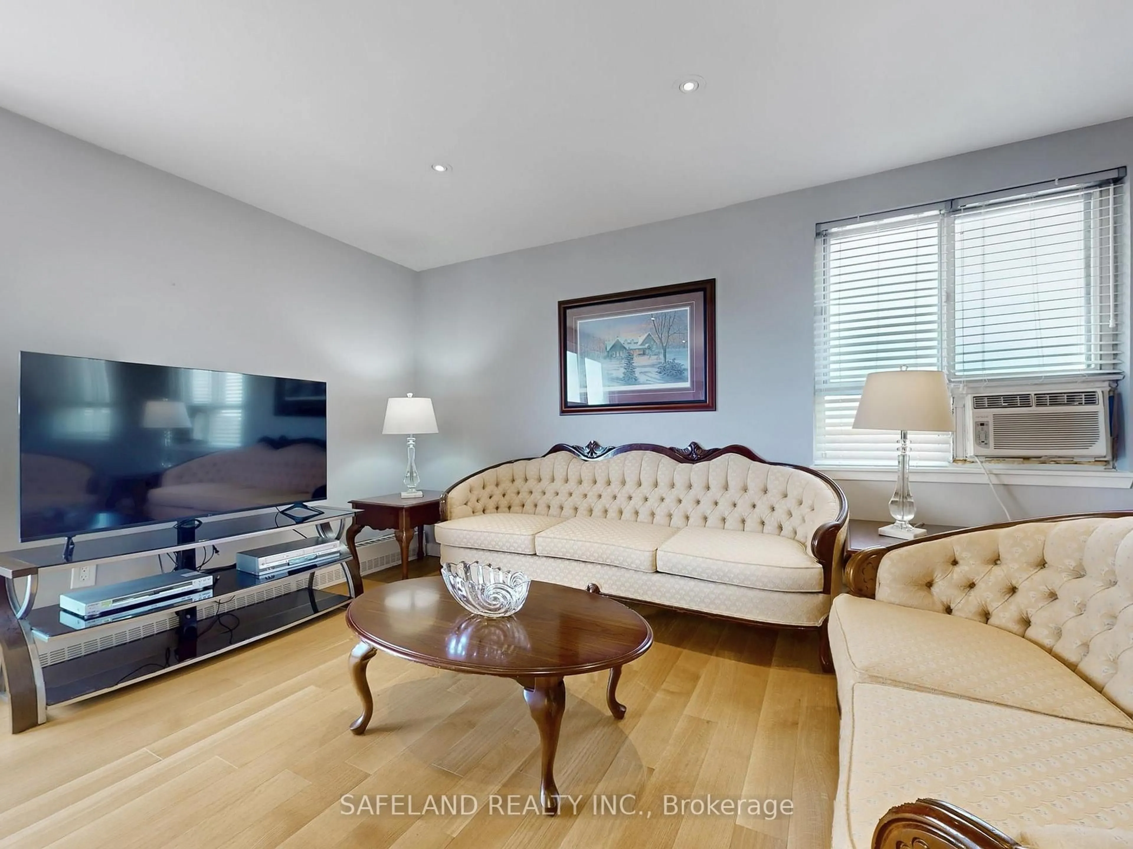Living room with furniture, wood/laminate floor for 1101 Pharmacy Ave #505, Toronto Ontario M1R 2H2