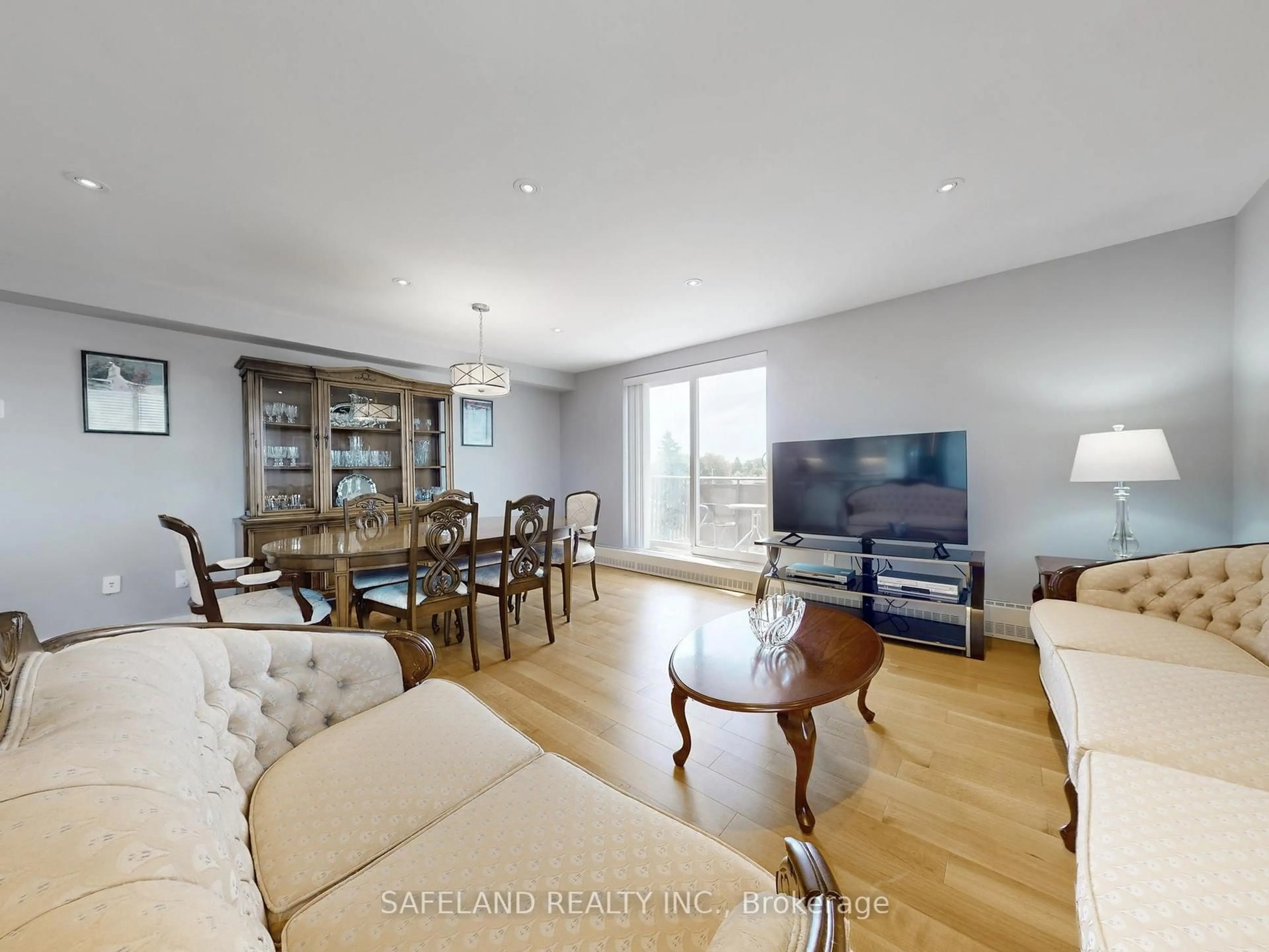 Living room with furniture, wood/laminate floor for 1101 Pharmacy Ave #505, Toronto Ontario M1R 2H2