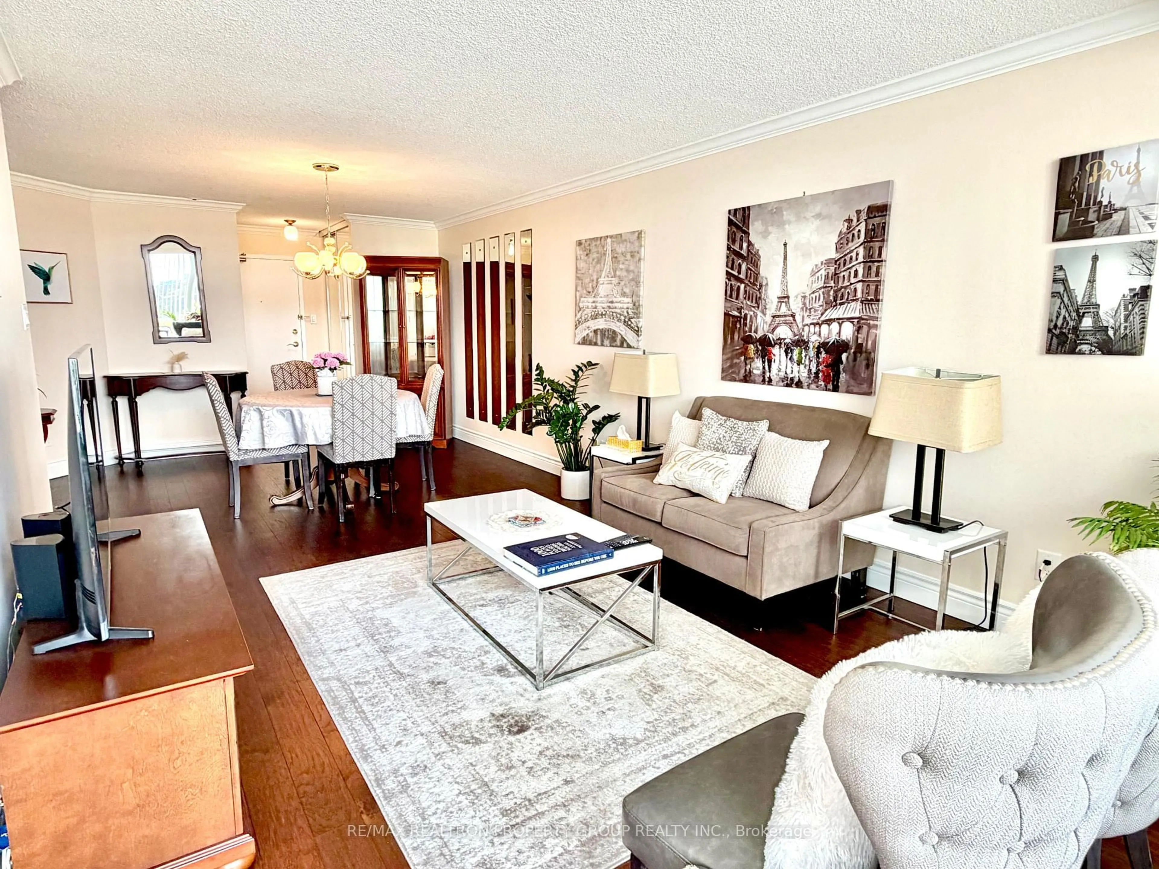 Living room with furniture, wood/laminate floor for 11753 Sheppard Ave #915, Toronto Ontario M1B 5M3
