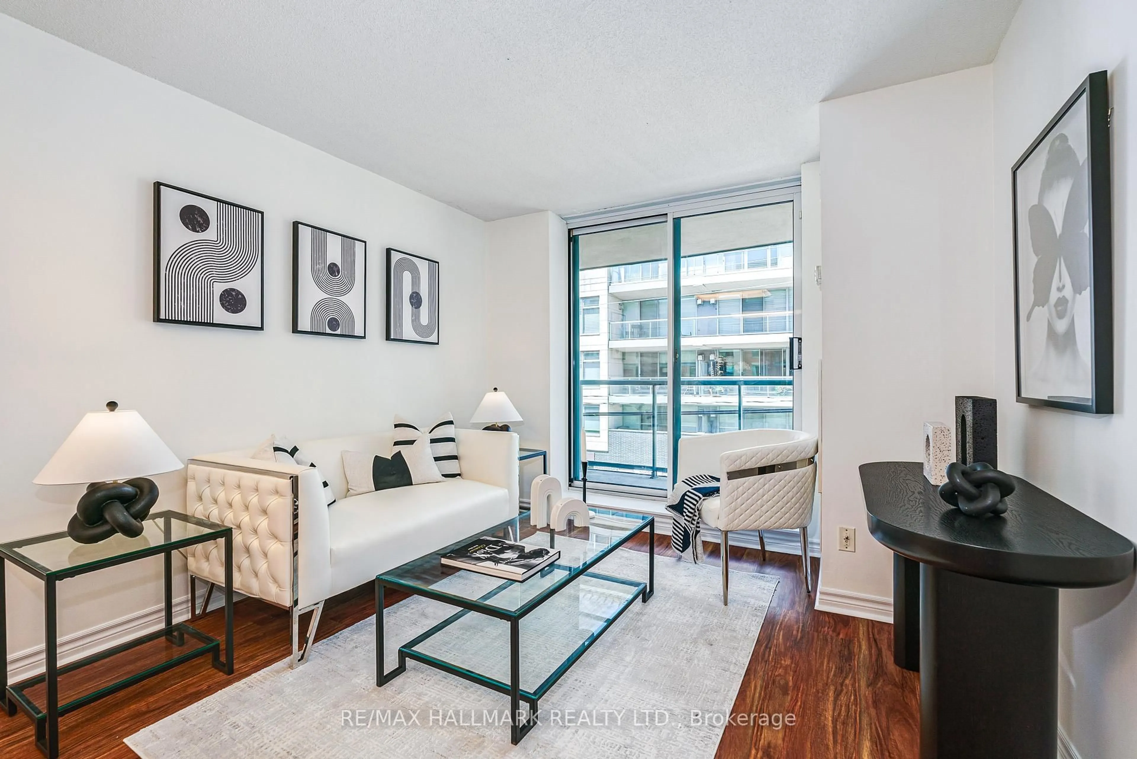 Living room with furniture, unknown for 1863 Queen St #311, Toronto Ontario M4L 3Y6