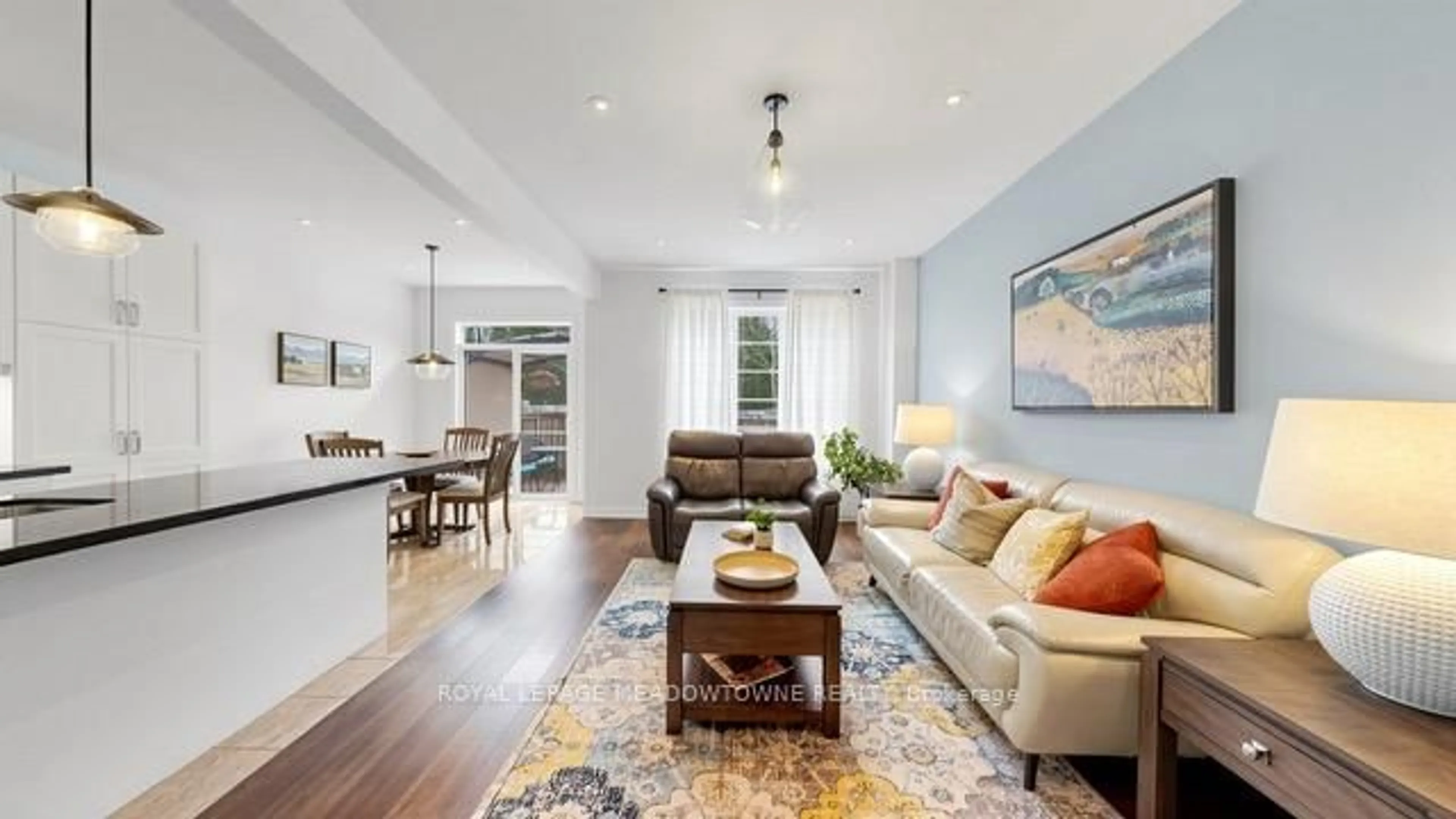 Living room with furniture, wood/laminate floor for 126 Bridlewood Blvd, Whitby Ontario L1R 0N2