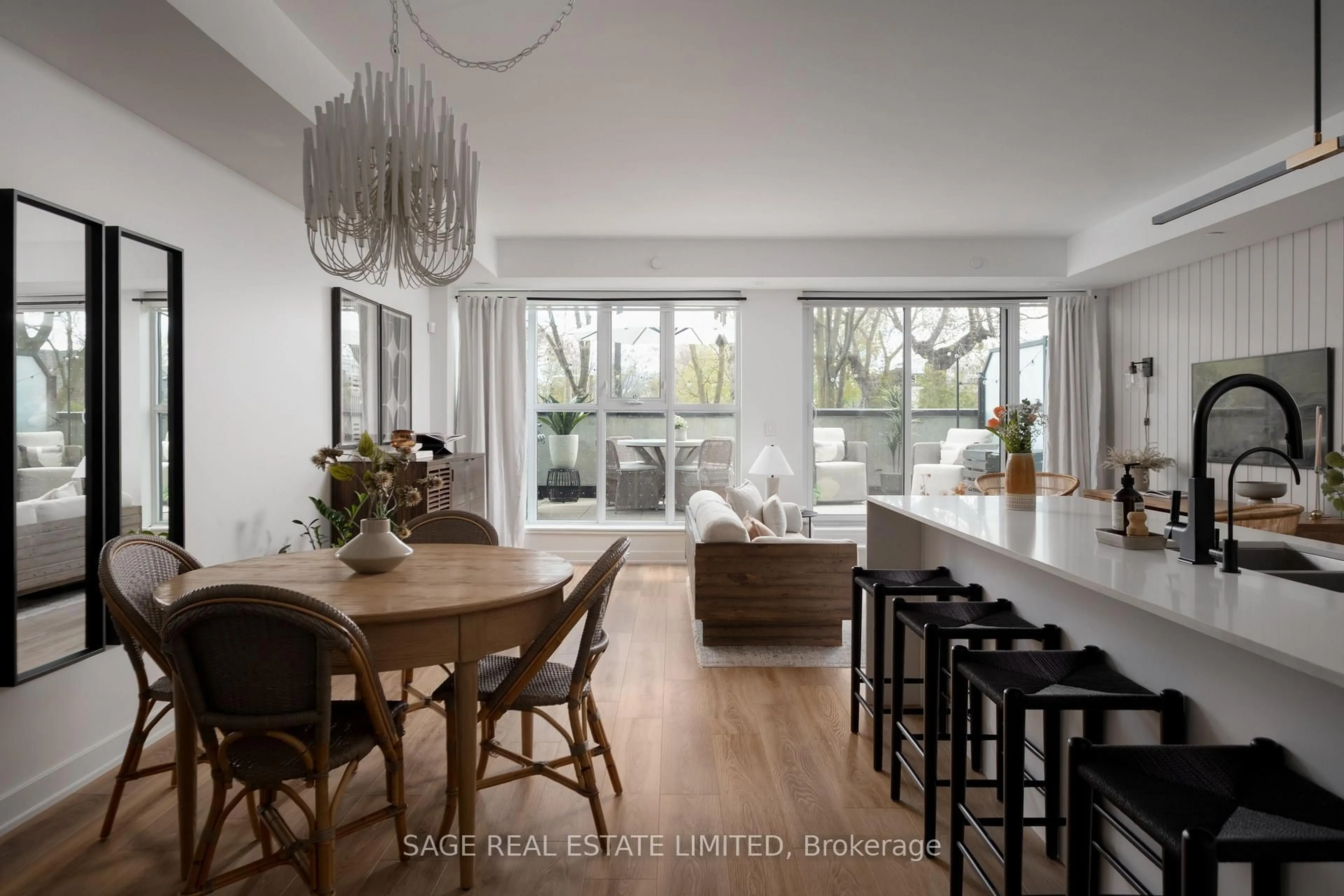 Open concept kitchen, wood/laminate floor for 899 Queen St #212, Toronto Ontario M4M 0C8