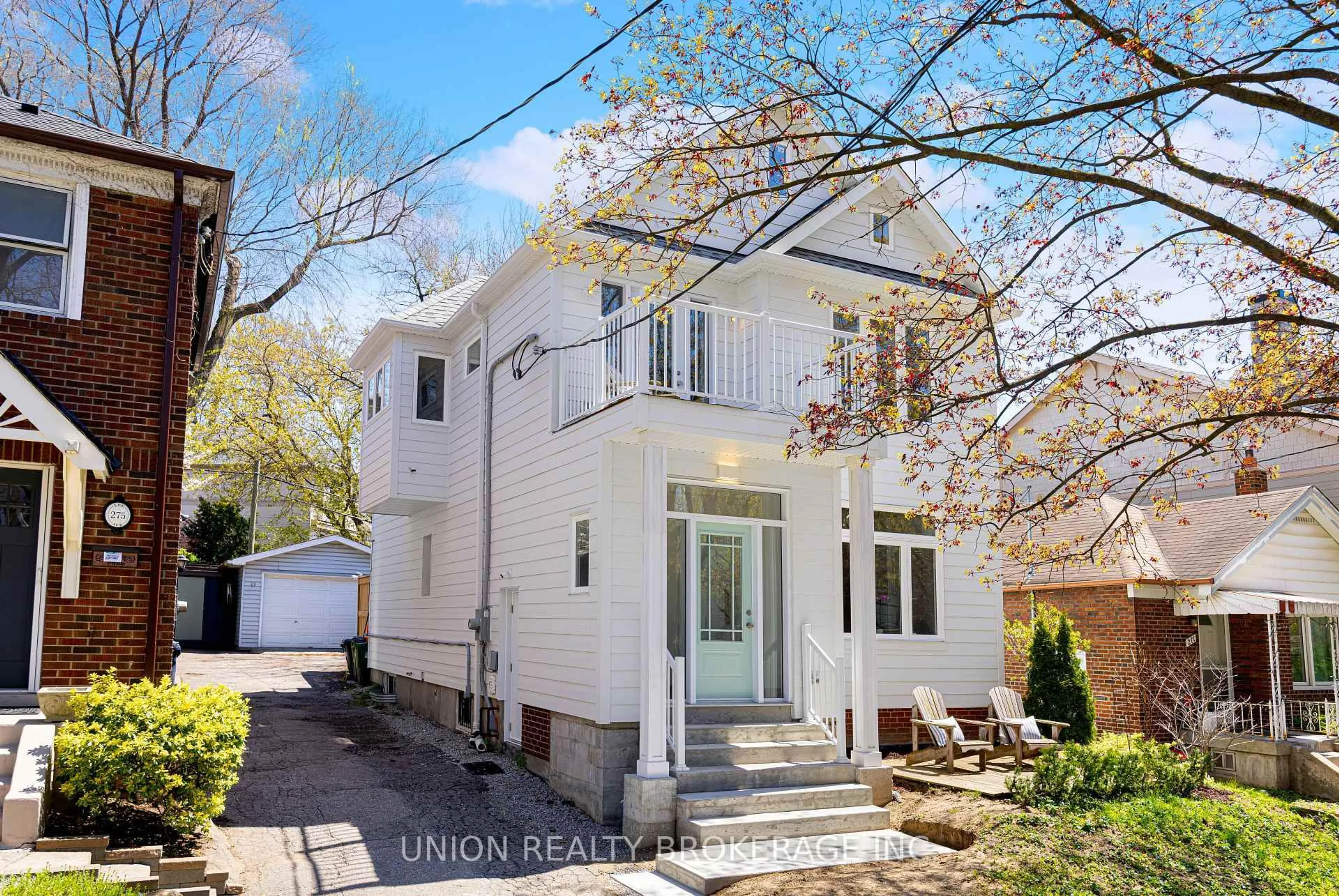 Home with vinyl exterior material, street for 273 Lee Ave, Toronto Ontario M4E 2P6