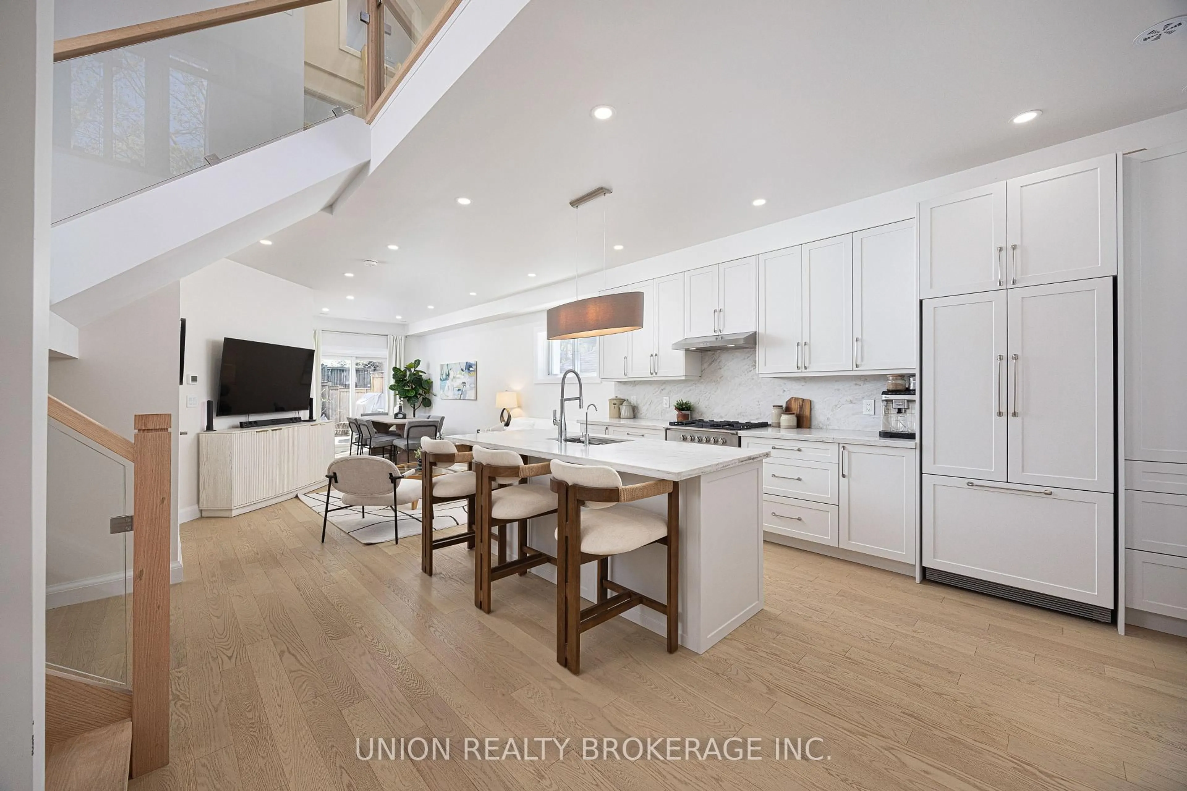 Open concept kitchen, wood/laminate floor for 273 Lee Ave, Toronto Ontario M4E 2P6
