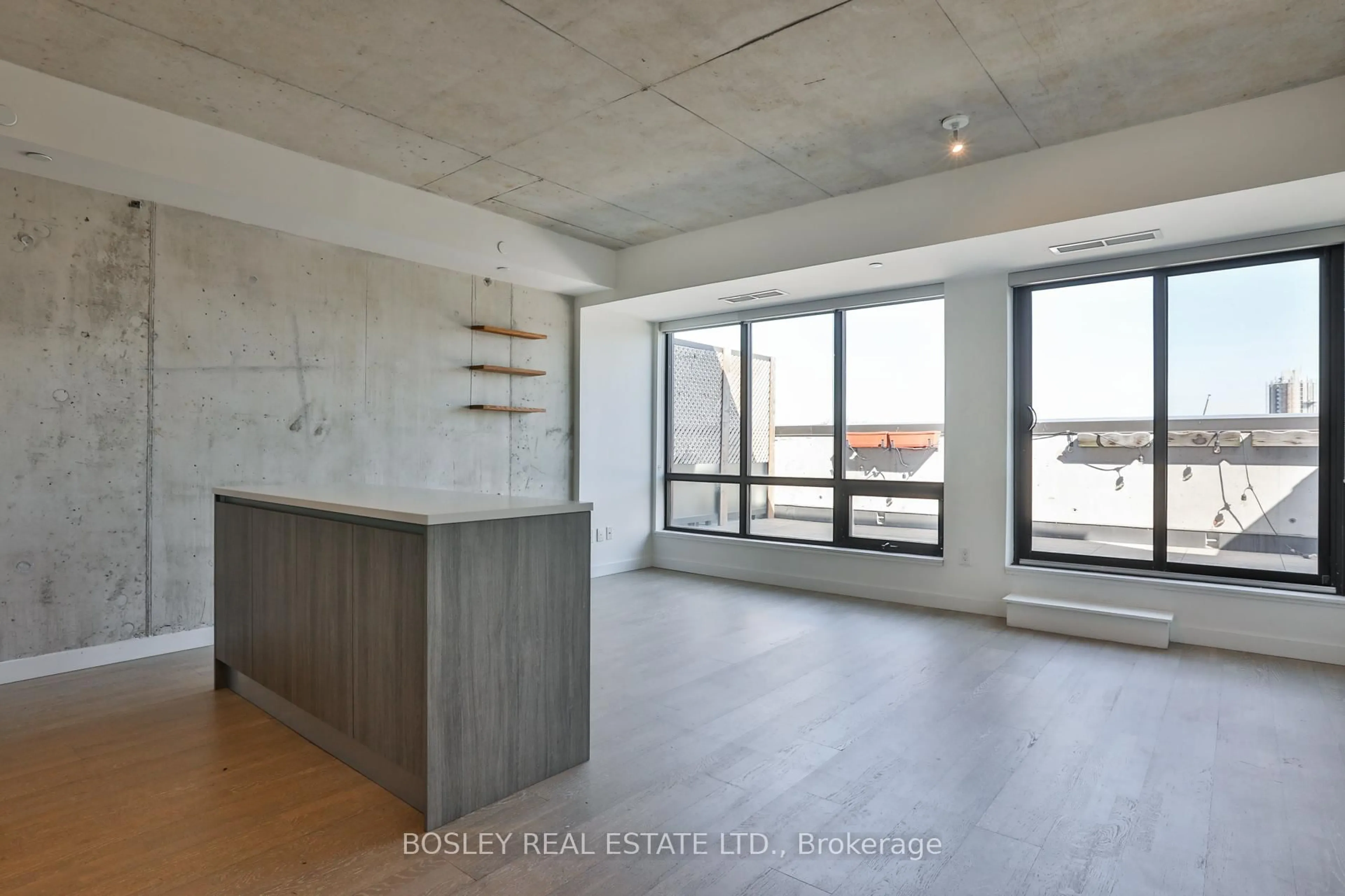 Open concept kitchen, cement floor for 246 Logan Ave #PH 714, Toronto Ontario M4M 0E9