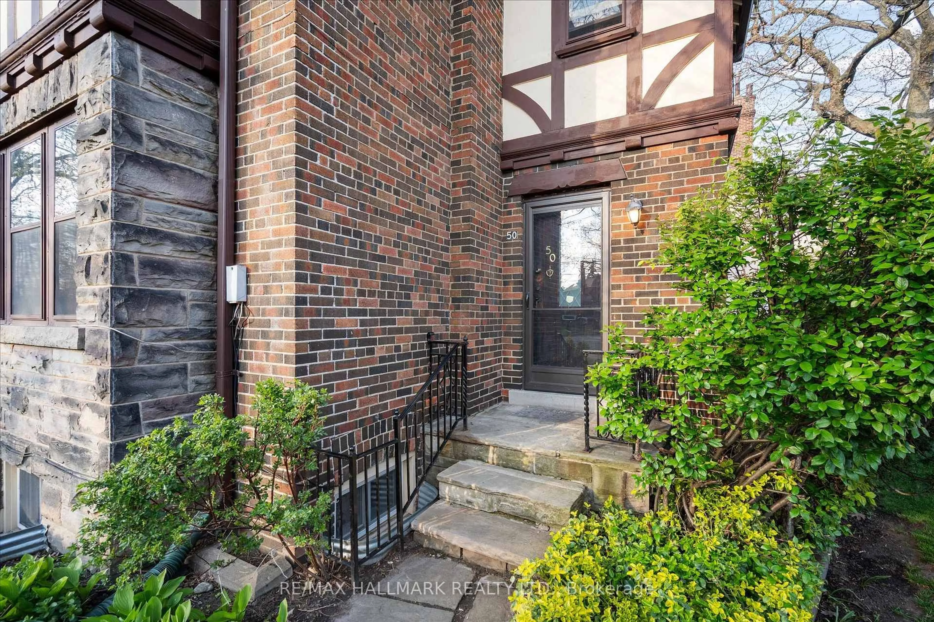 Home with brick exterior material, street for 50 Benlamond Ave, Toronto Ontario M4E 1Y9