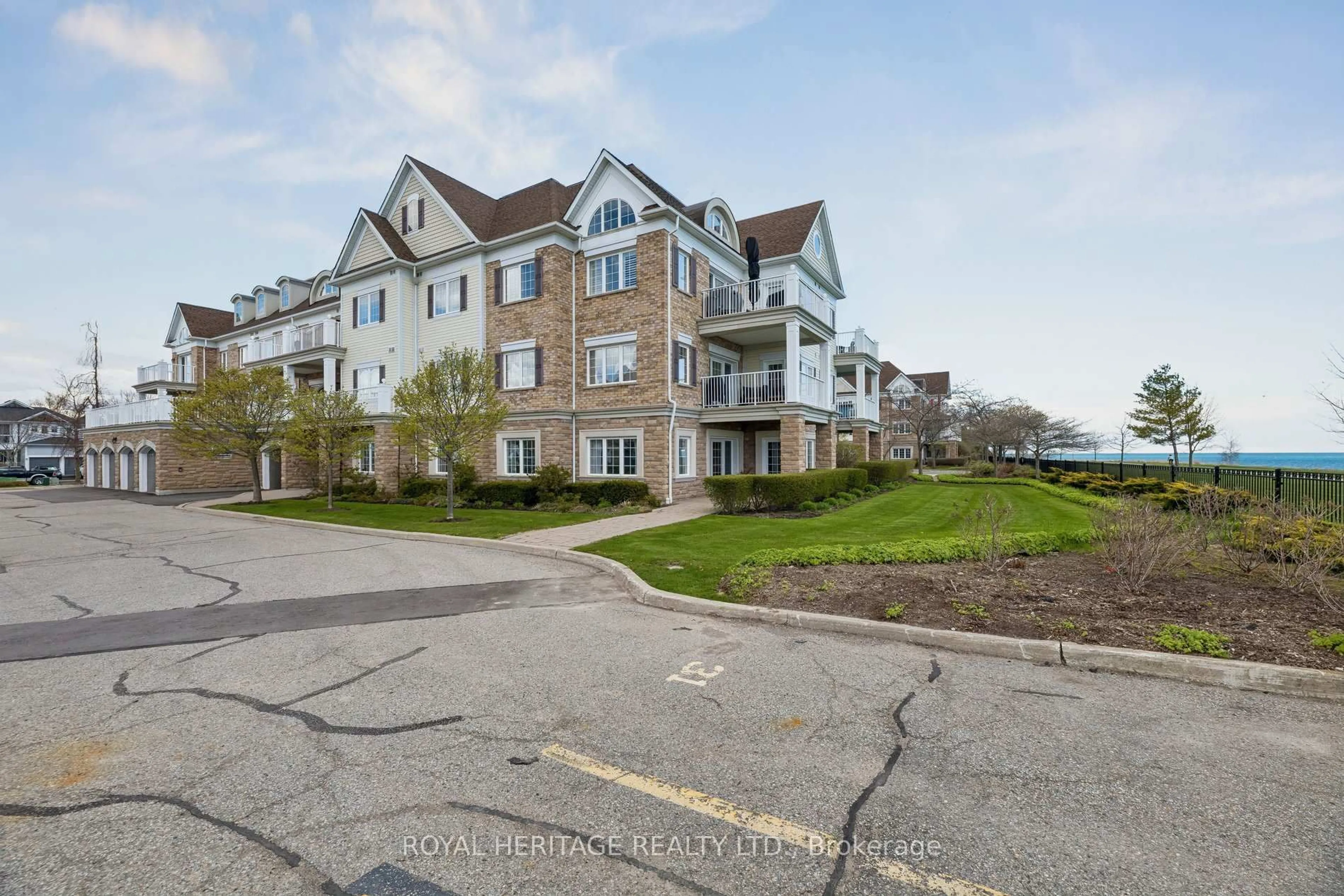 A pic from outside/outdoor area/front of a property/back of a property/a pic from drone, water/lake/river/ocean view for 385 Lakebreeze Dr #101, Clarington Ontario L1B 1P5