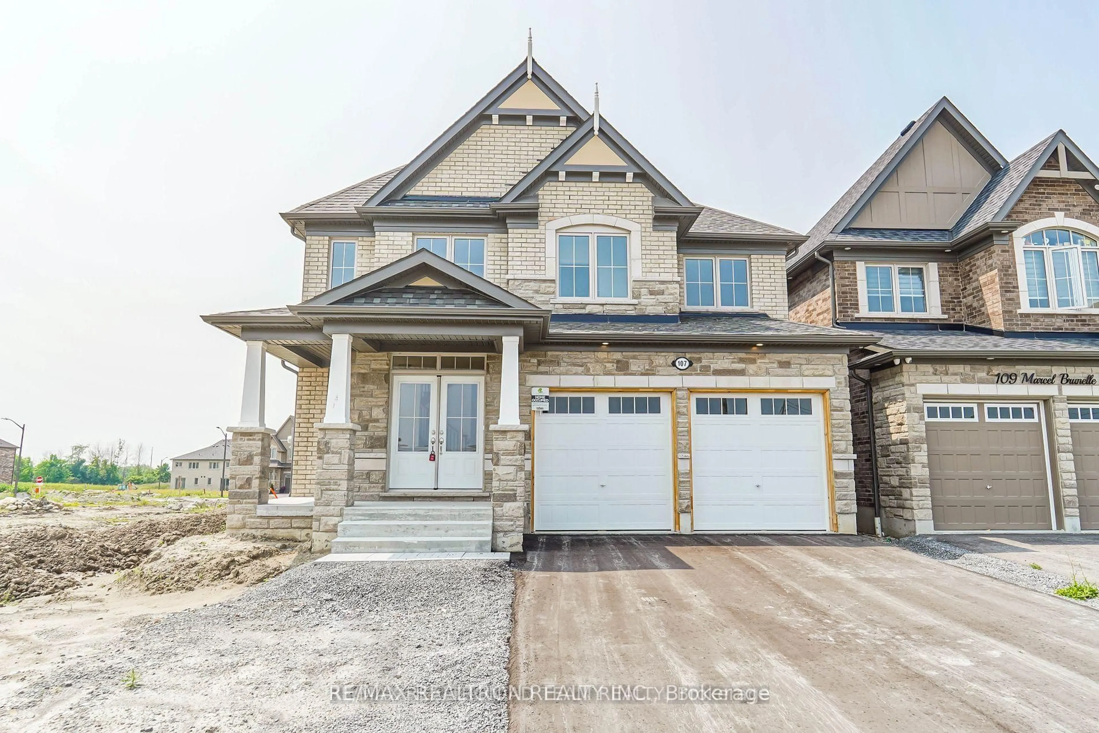 Home with brick exterior material, street for 107 Marcel Brunelle Dr, Whitby Ontario L1P 0G7