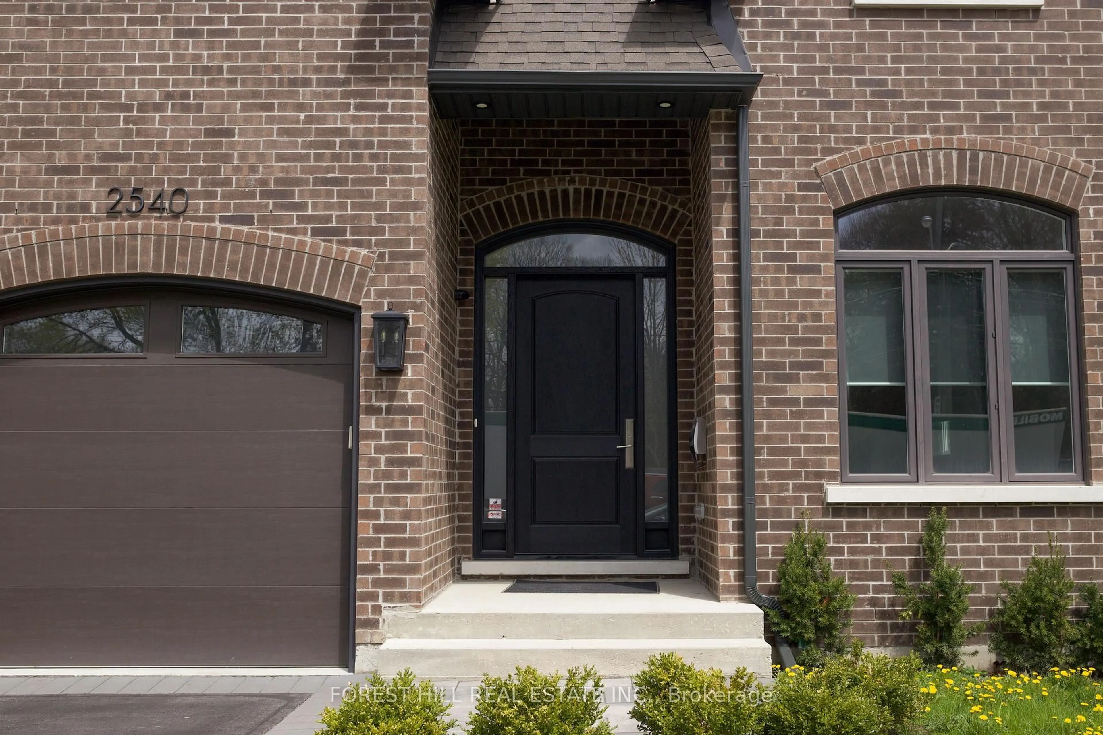 Home with brick exterior material, street for 2540 St Clair Ave, Toronto Ontario M4B 1M1