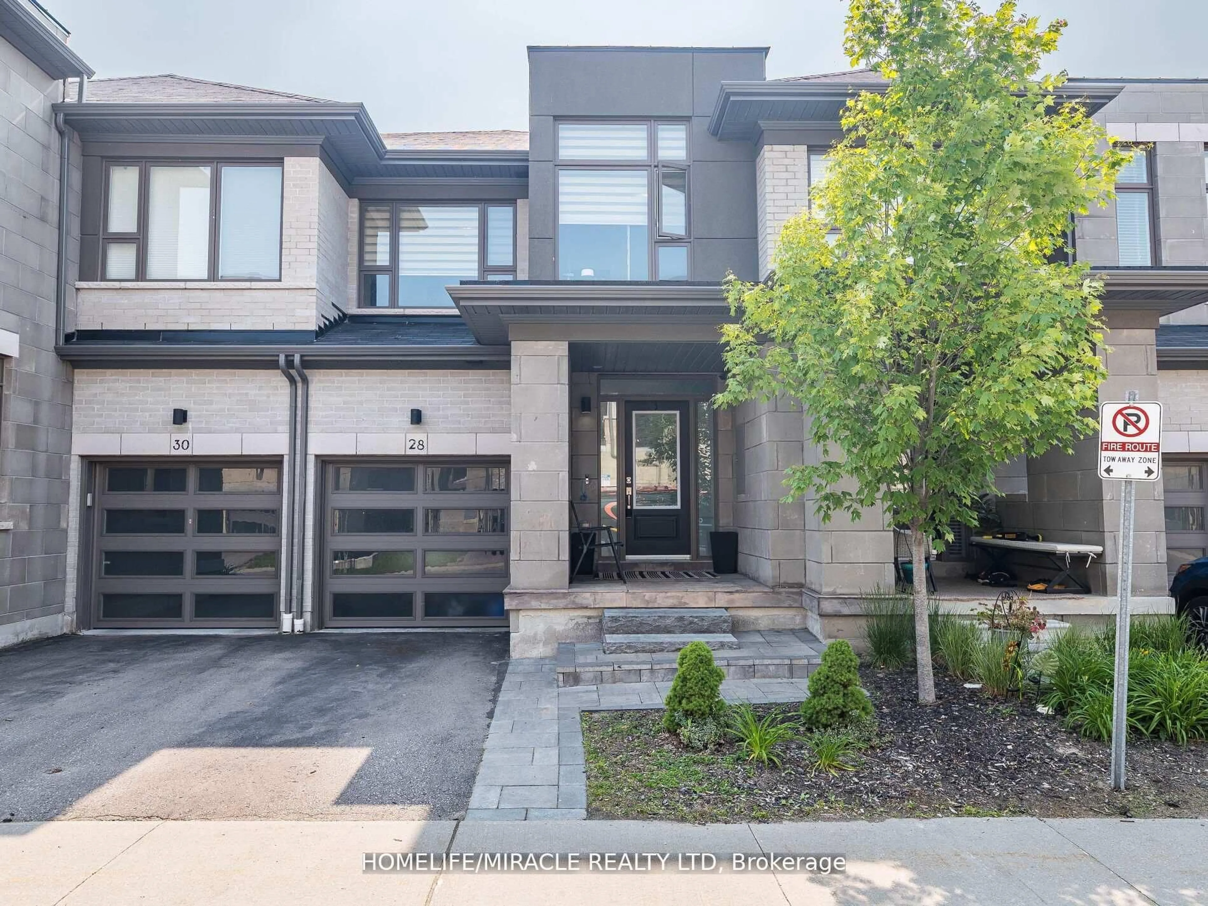 Home with brick exterior material, street for 28 Donald Fleming Way #147, Whitby Ontario L1R 0N8