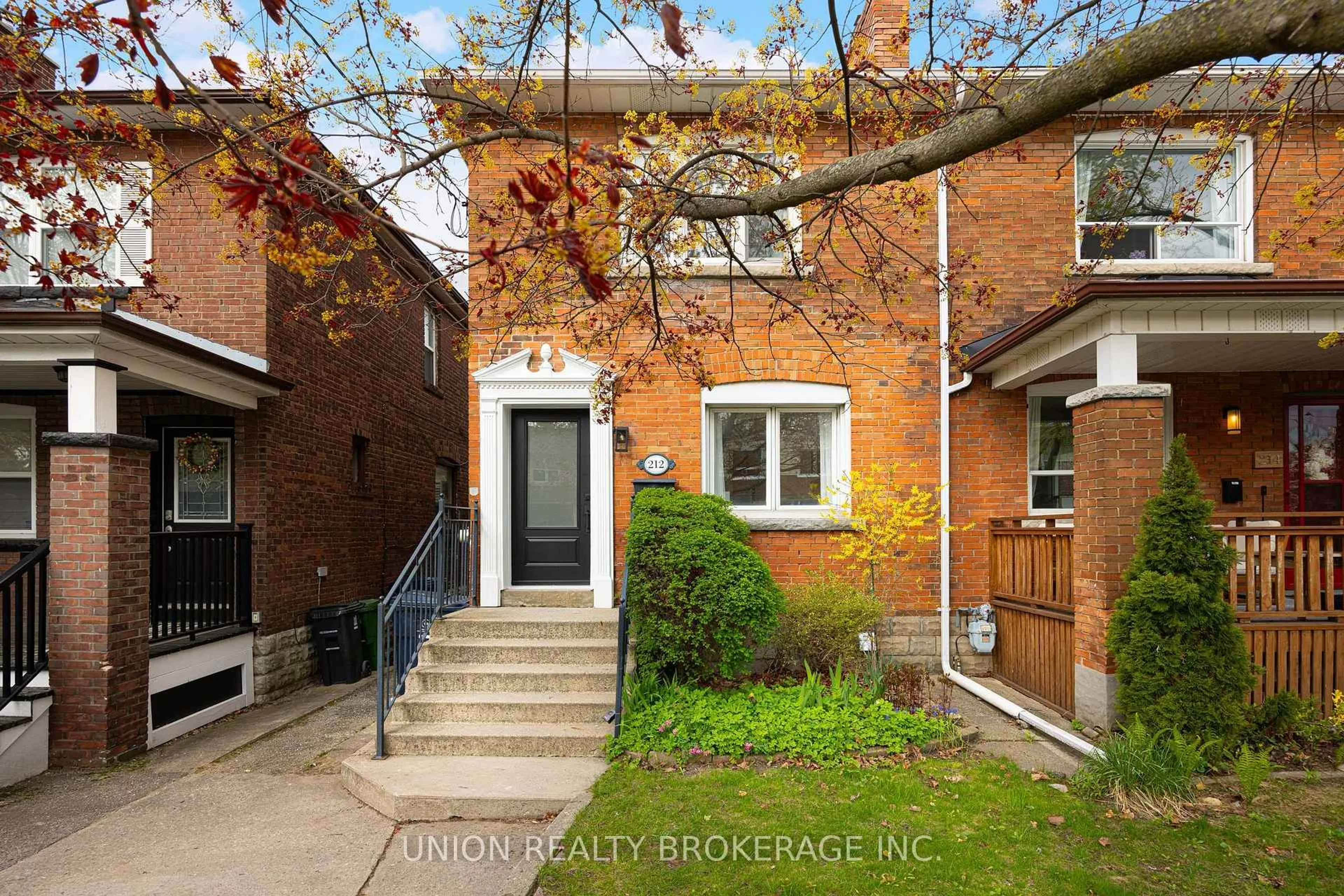 Home with brick exterior material, street for 212 Dewhurst Blvd, Toronto Ontario M4J 3K3
