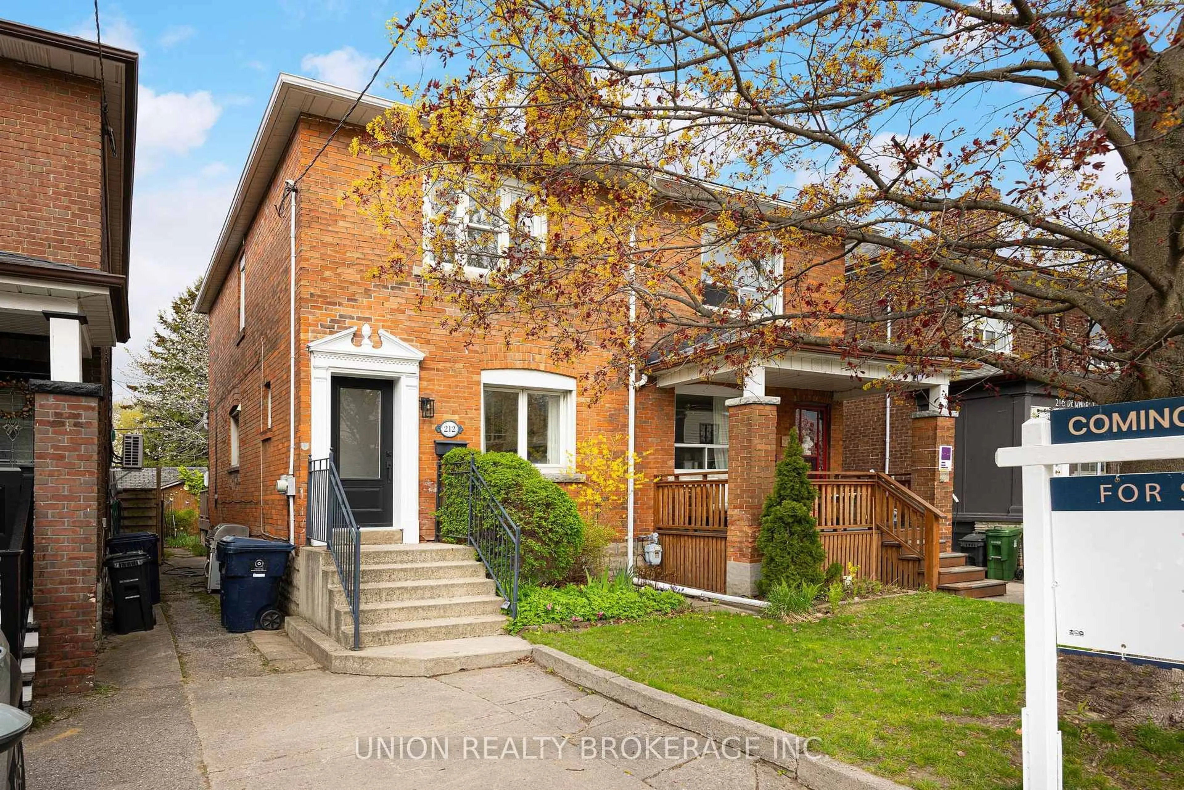 Home with brick exterior material, street for 212 Dewhurst Blvd, Toronto Ontario M4J 3K3