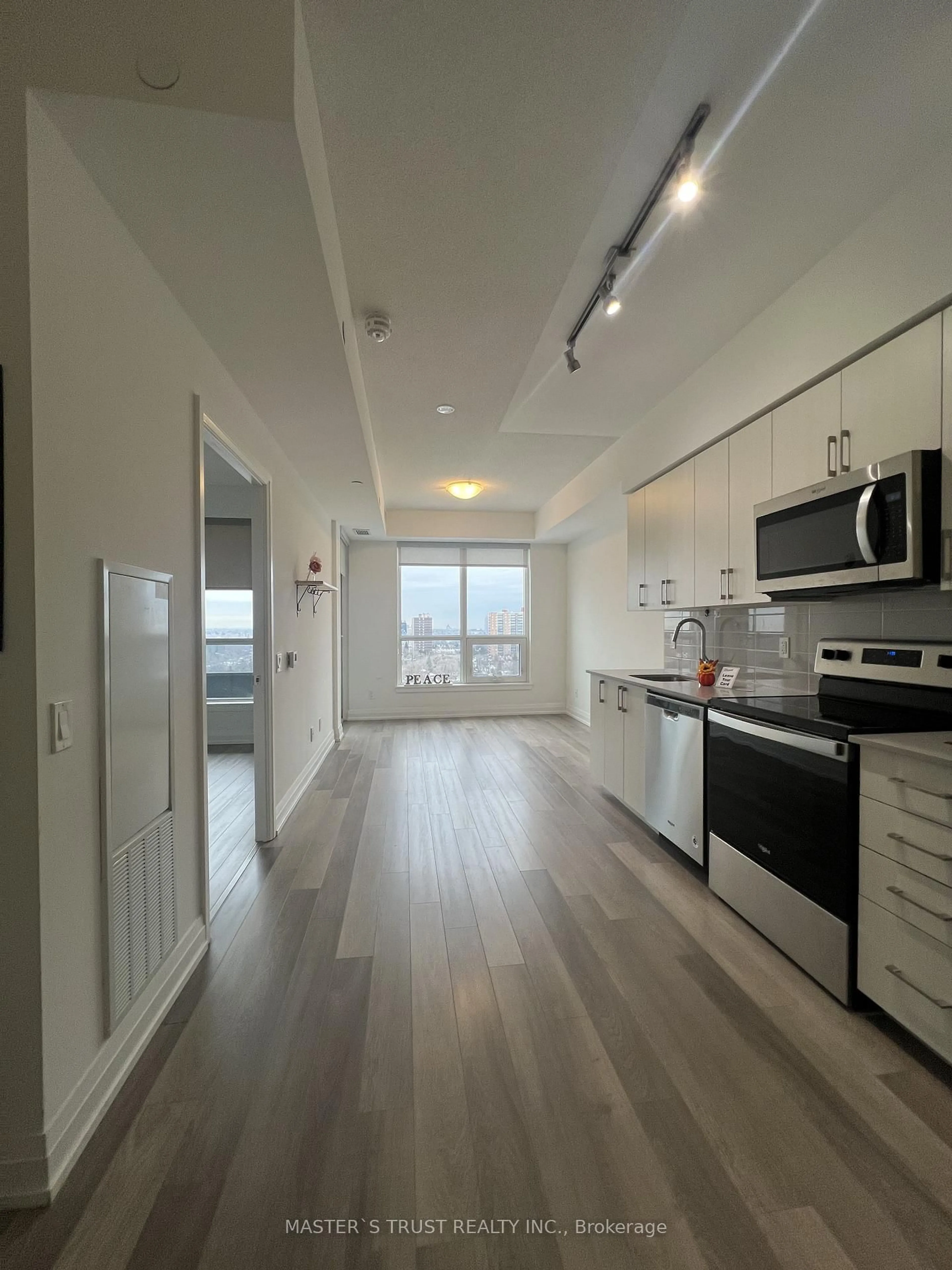 Open concept kitchen, wood/laminate floor for 3121 Sheppard Ave #1501, Toronto Ontario M1T 0B6