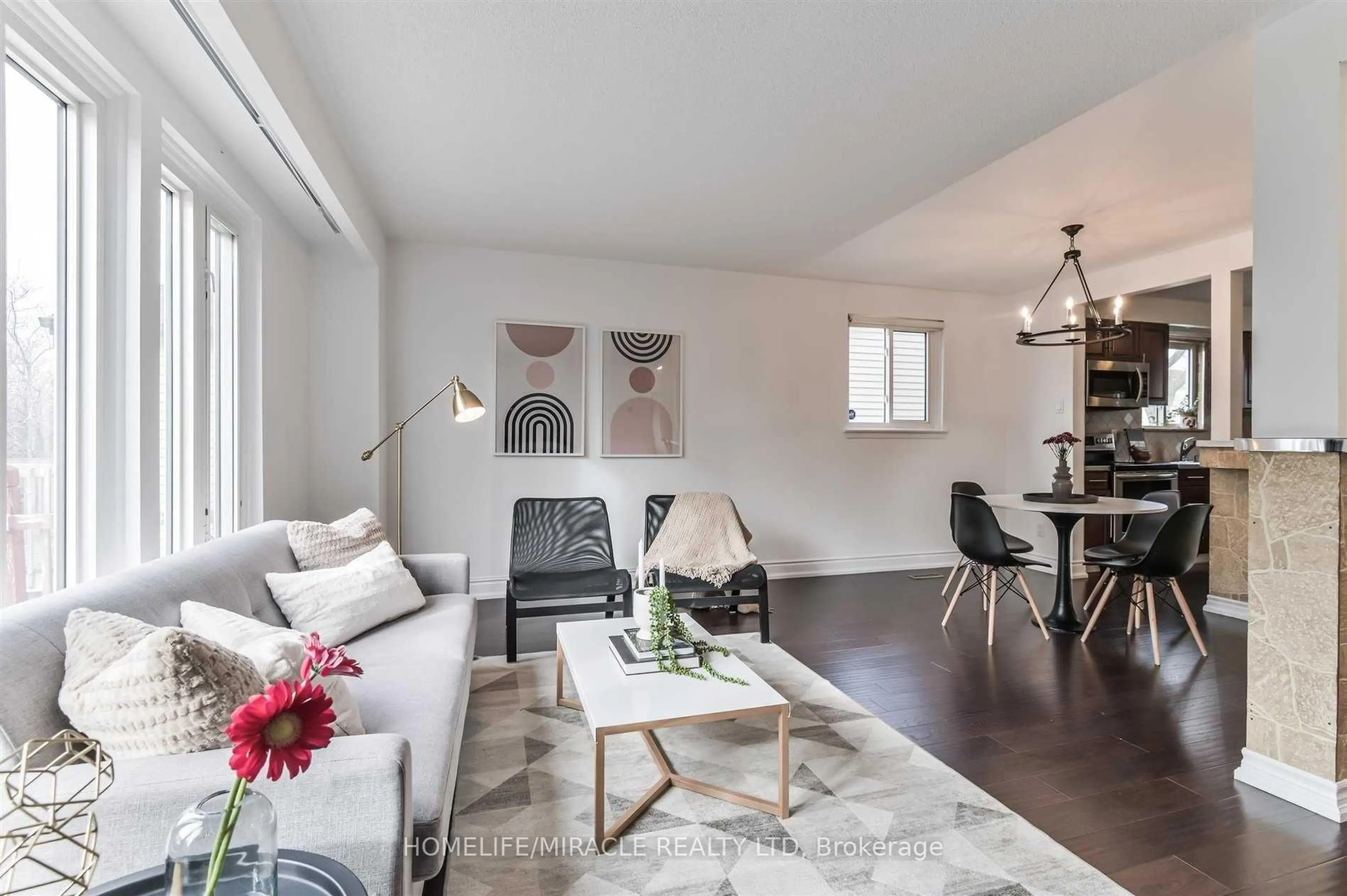 Living room with furniture, wood/laminate floor for 37 Banner Cres, Ajax Ontario L1S 3S8
