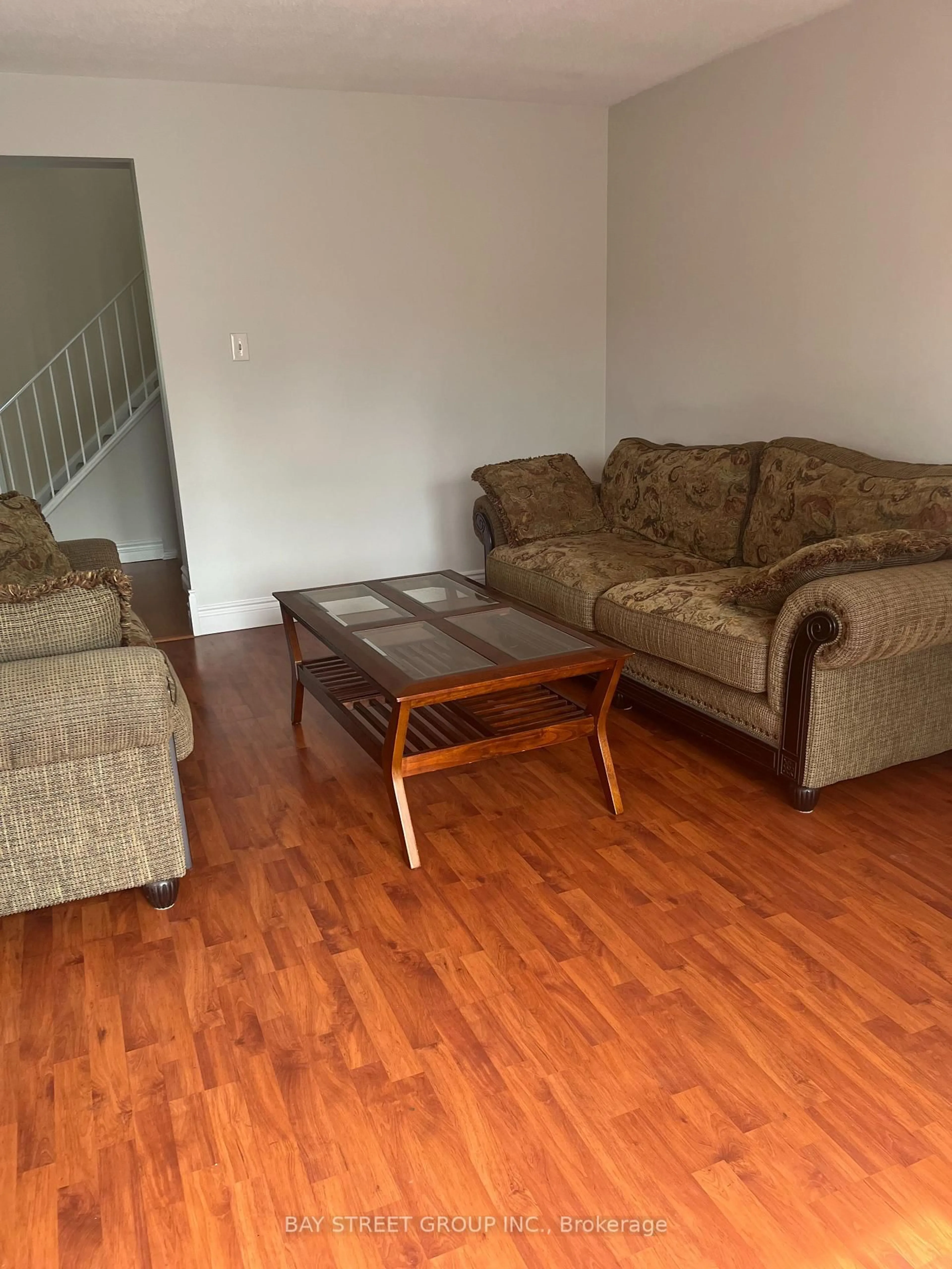 Living room with furniture, wood/laminate floor for 296 Killdeer St, Oshawa Ontario L1G 6X3