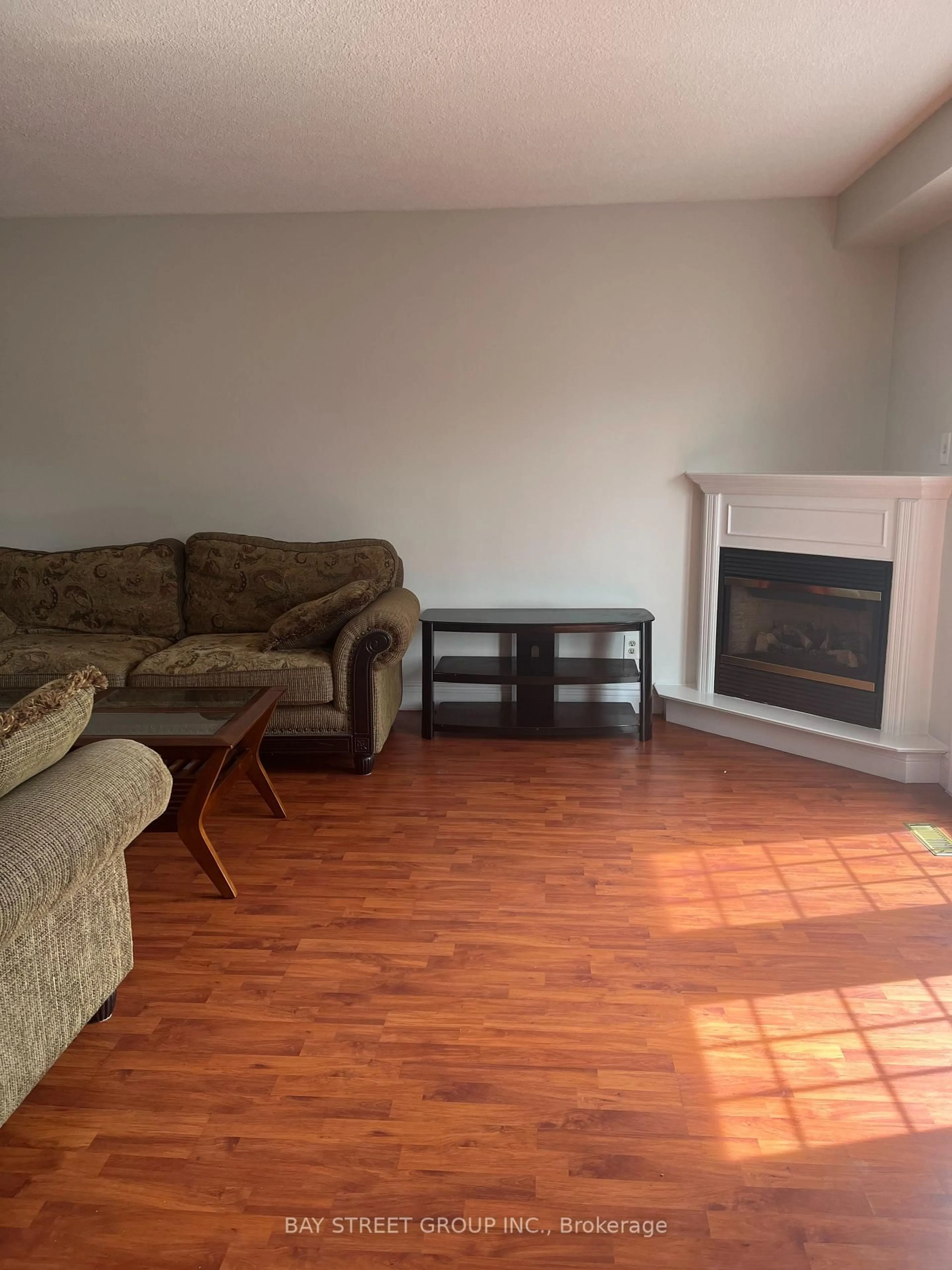 Living room with furniture, wood/laminate floor for 296 Killdeer St, Oshawa Ontario L1G 6X3
