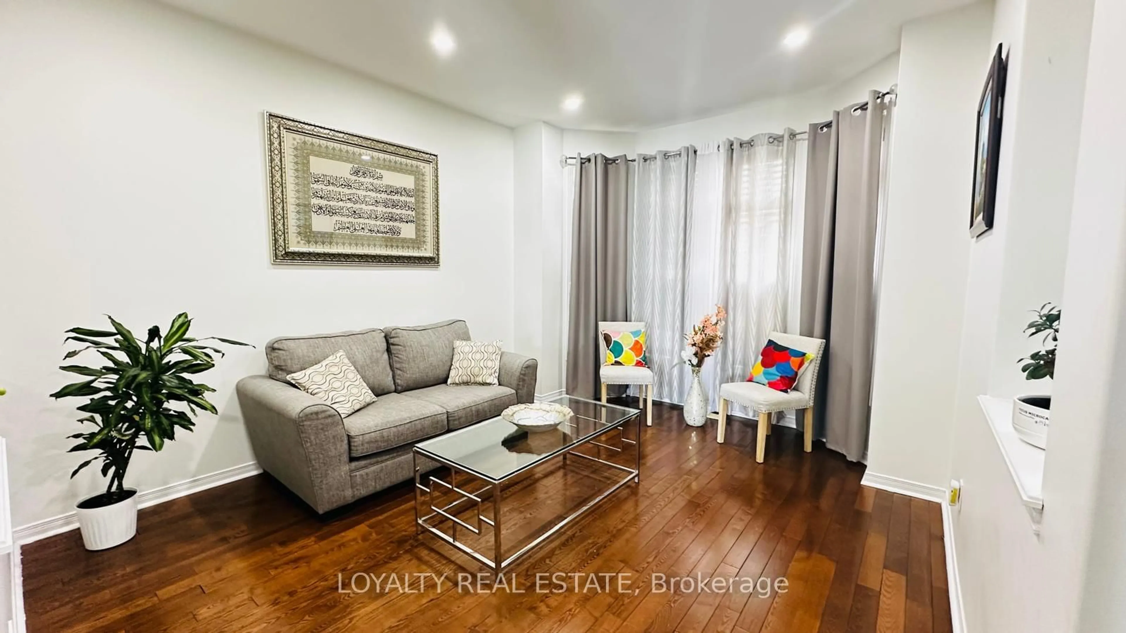 Living room with furniture, wood/laminate floor for 5 Southam St, Ajax Ontario L1Z 1R6