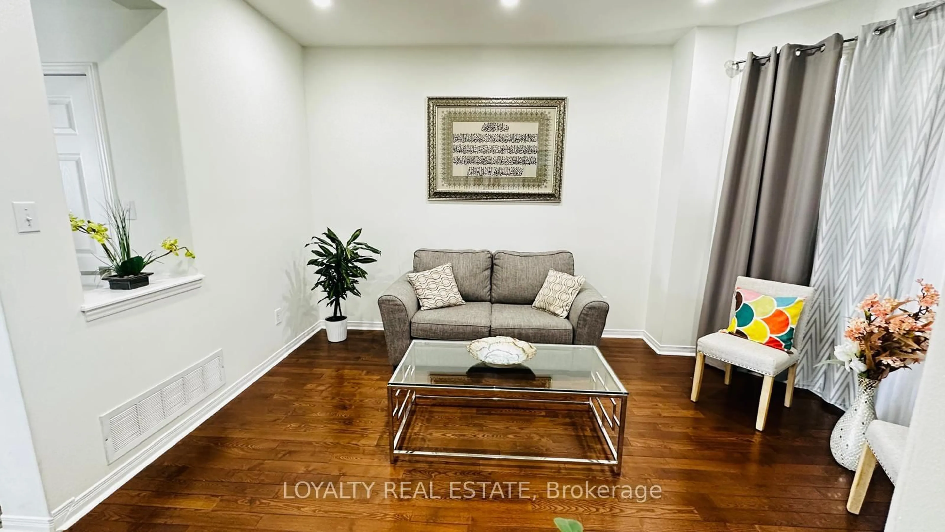 Living room with furniture, wood/laminate floor for 5 Southam St, Ajax Ontario L1Z 1R6