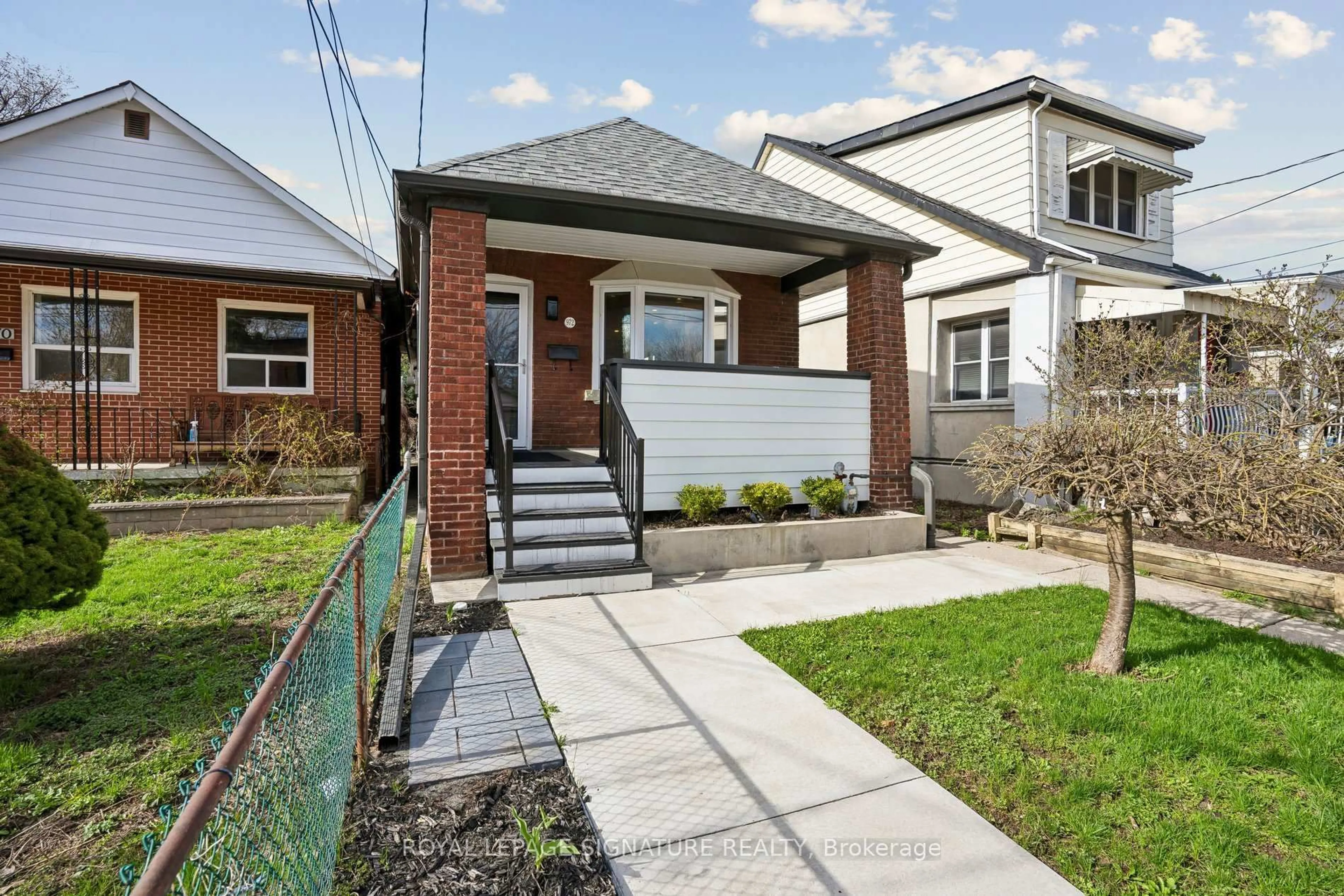 Home with brick exterior material, street for 972 Cosburn Ave, Toronto Ontario M4C 2W9