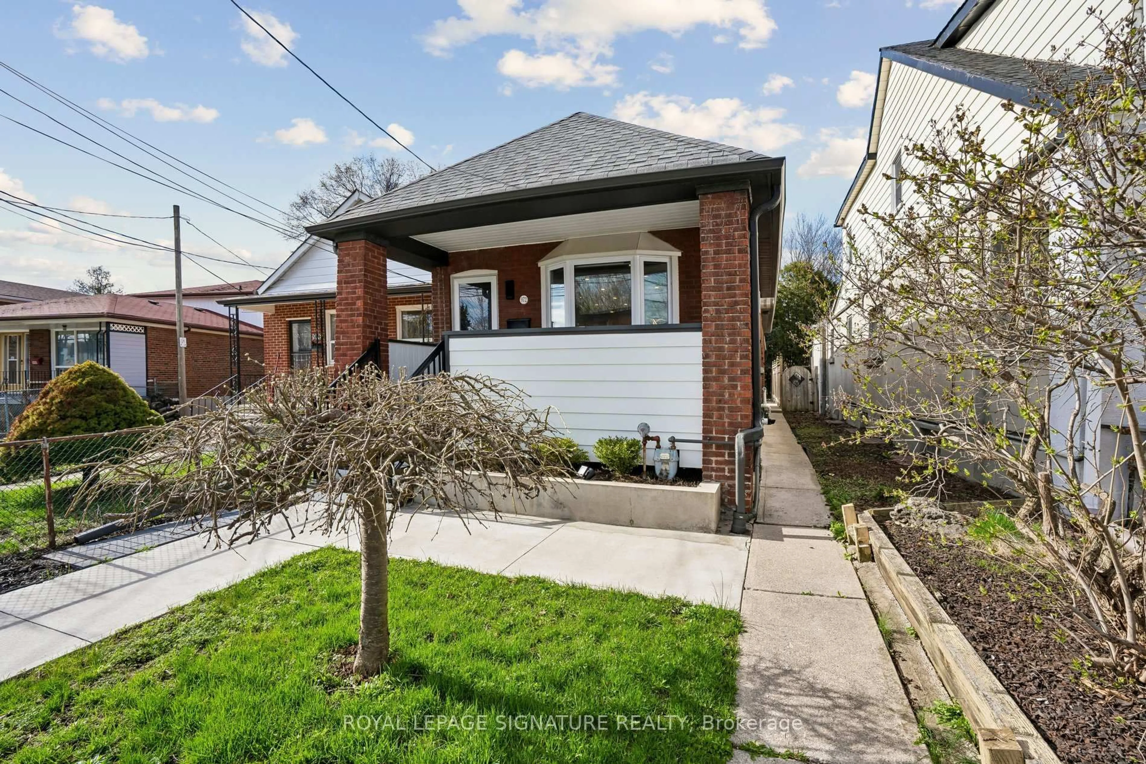 Home with brick exterior material, street for 972 Cosburn Ave, Toronto Ontario M4C 2W9