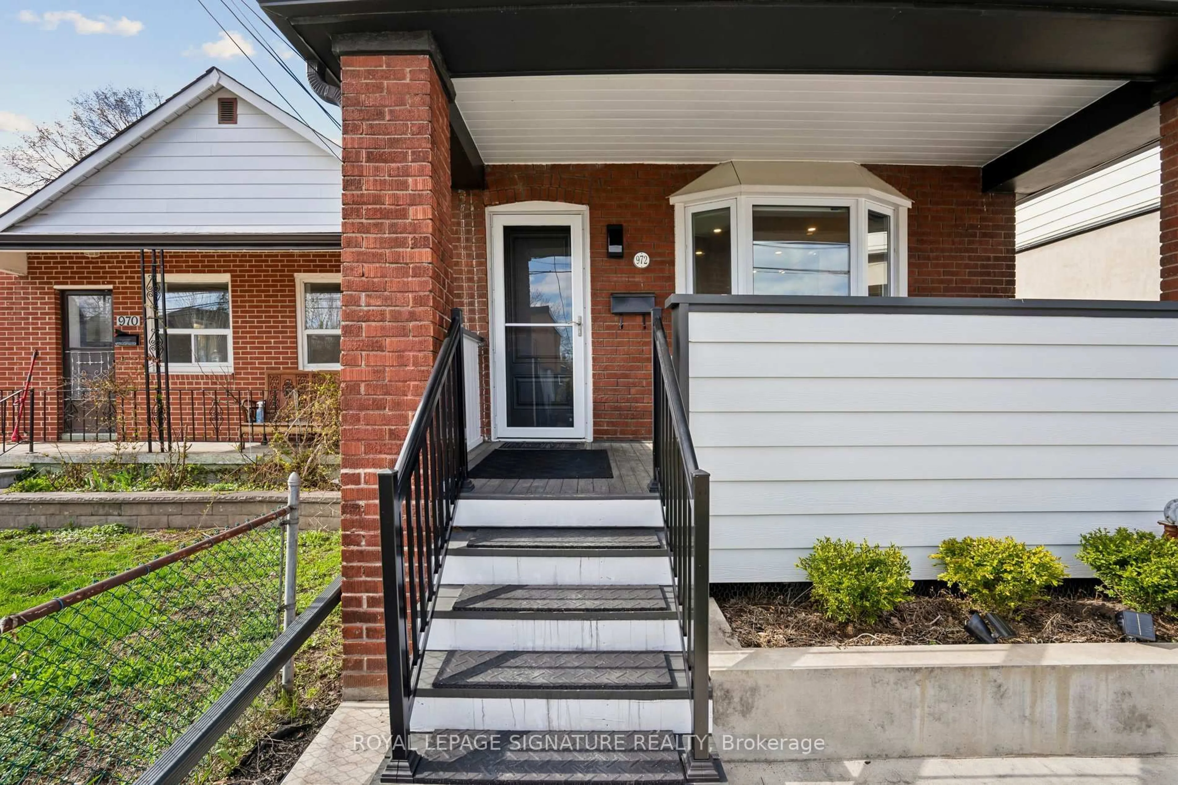 Home with brick exterior material, street for 972 Cosburn Ave, Toronto Ontario M4C 2W9