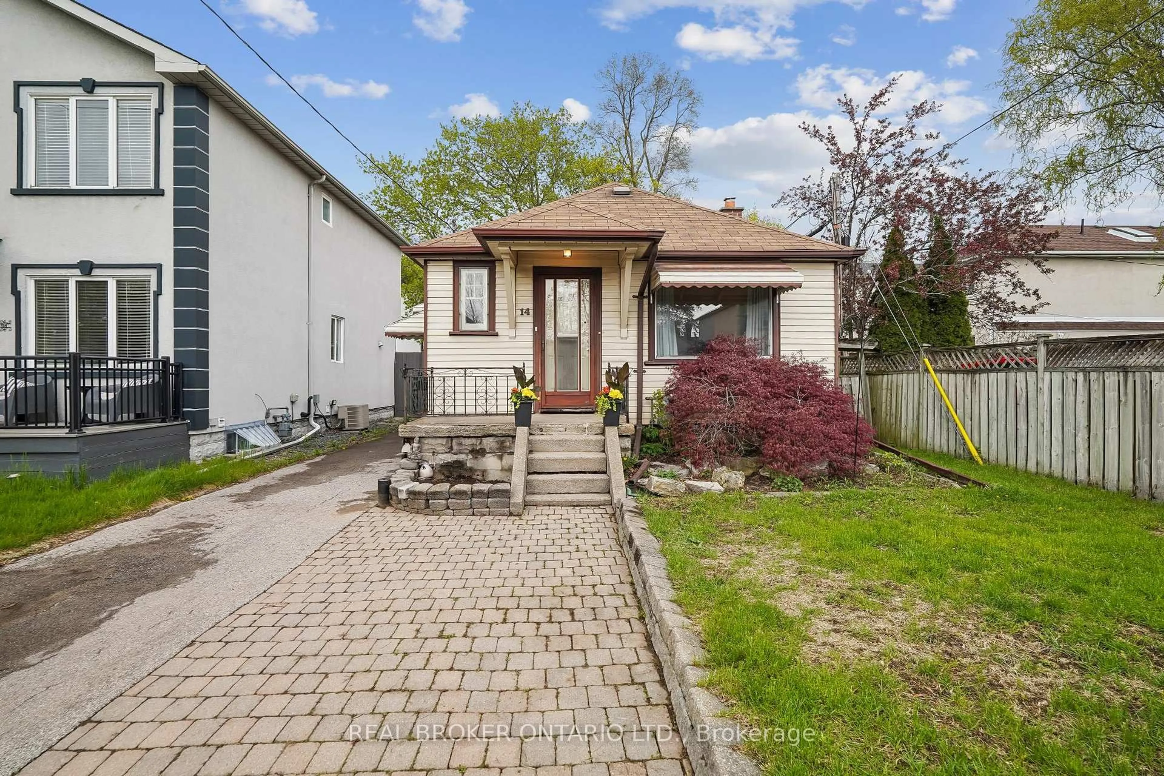 Home with brick exterior material, street for 14 Plains Rd, Toronto Ontario M4J 2R1