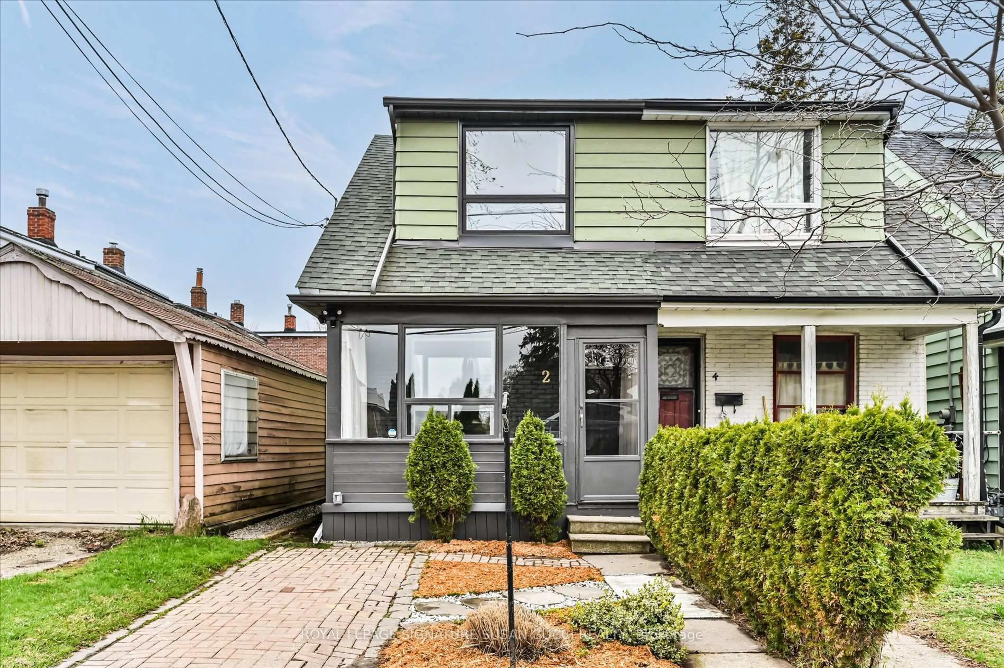 Home with vinyl exterior material, street for 2 Newman Ave, Toronto Ontario M4C 5A4