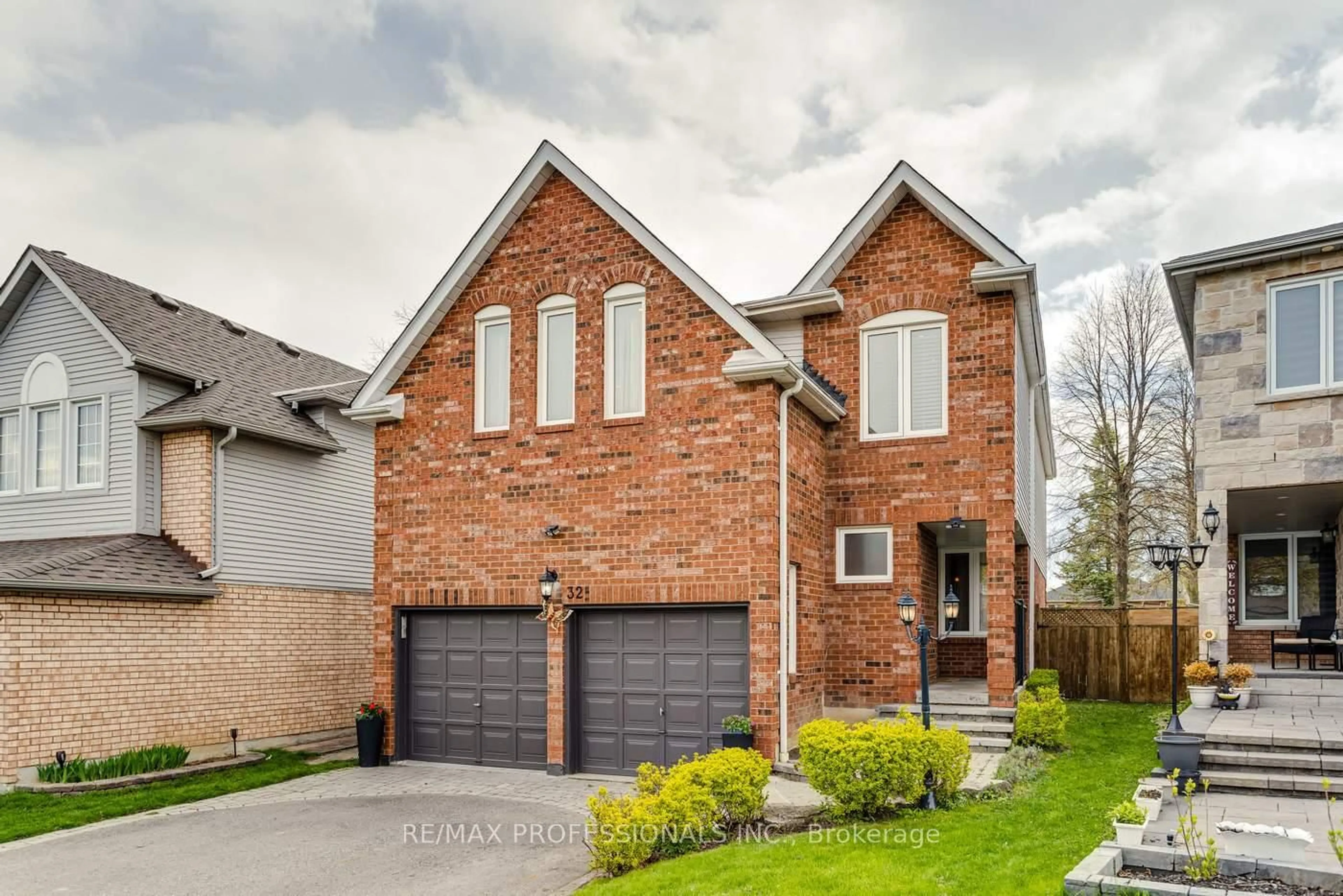 Home with brick exterior material, street for 32 Heaver Dr, Whitby Ontario L1N 8X2
