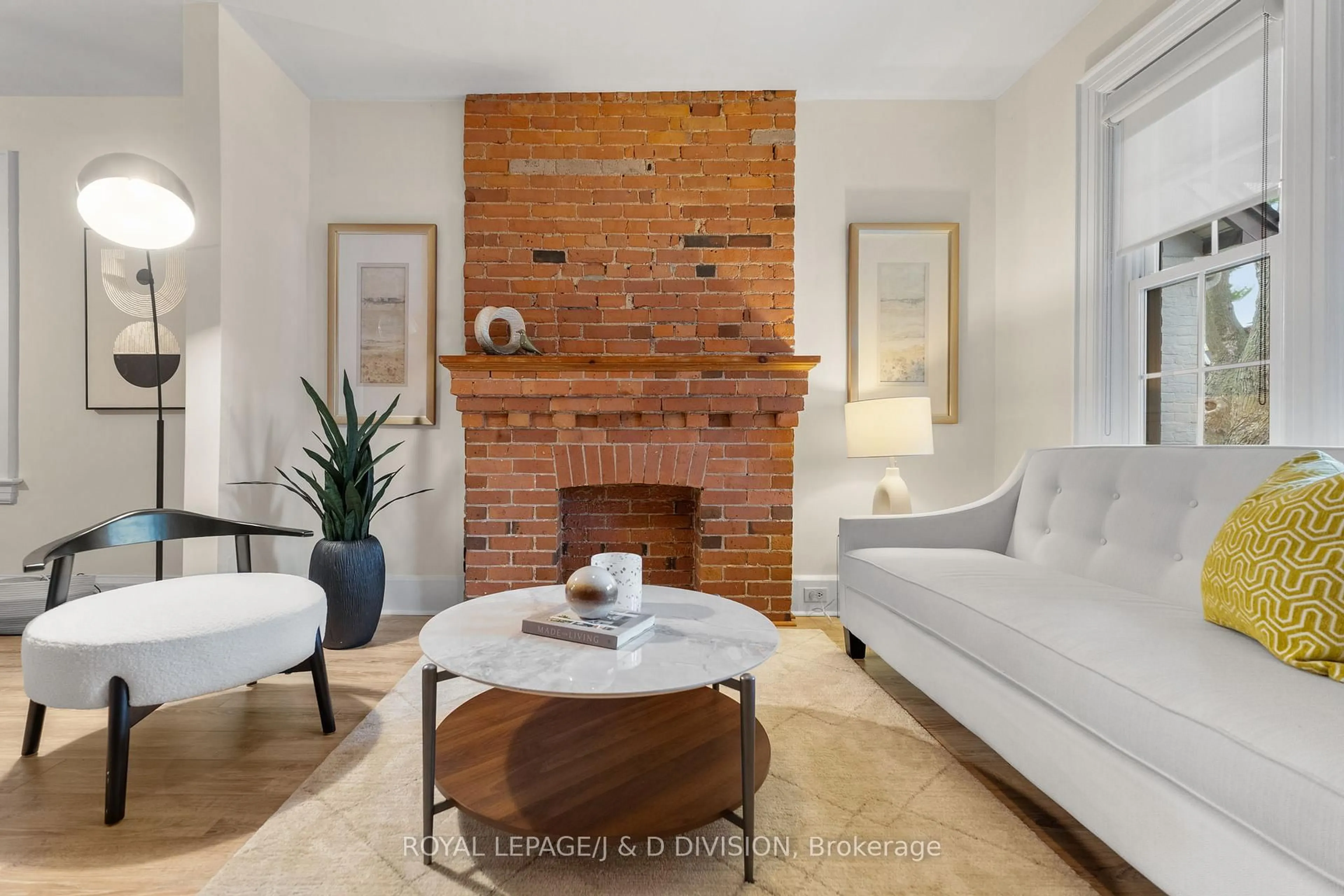 Living room with furniture, ceramic/tile floor for 87 Kent Rd, Toronto Ontario M4L 2X5