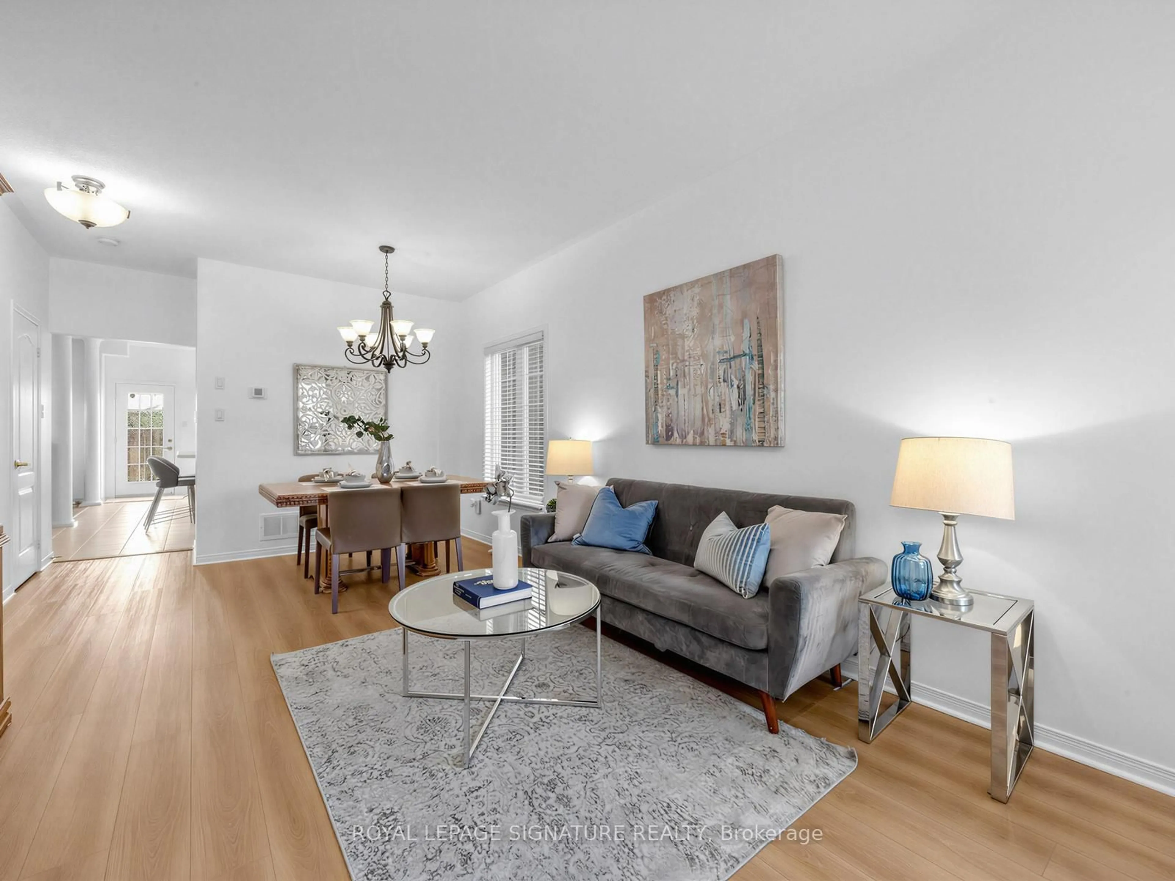 Living room with furniture, wood/laminate floor for 74 Styles Cres, Ajax Ontario L1Z 0A8
