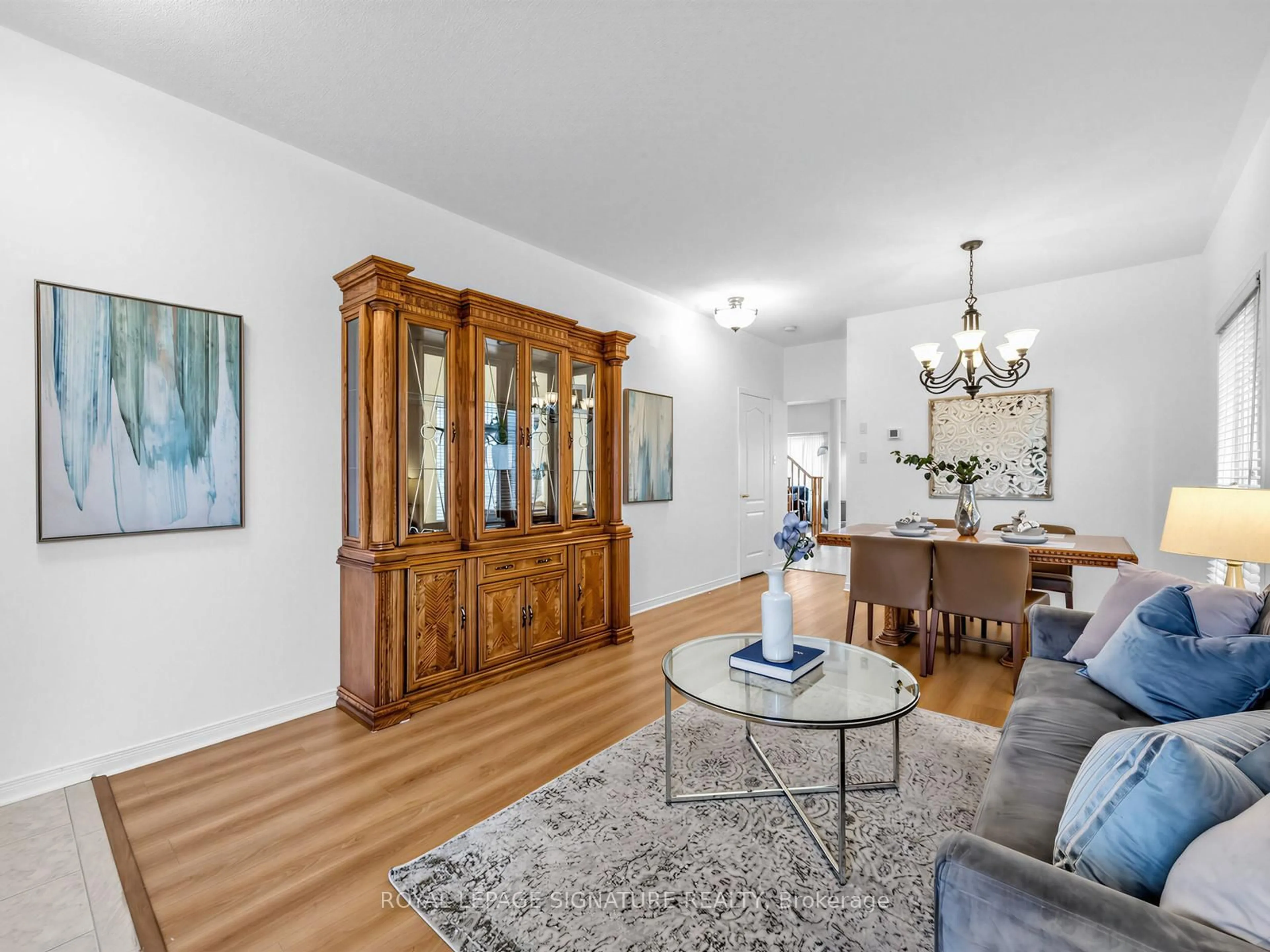 Living room with furniture, wood/laminate floor for 74 Styles Cres, Ajax Ontario L1Z 0A8