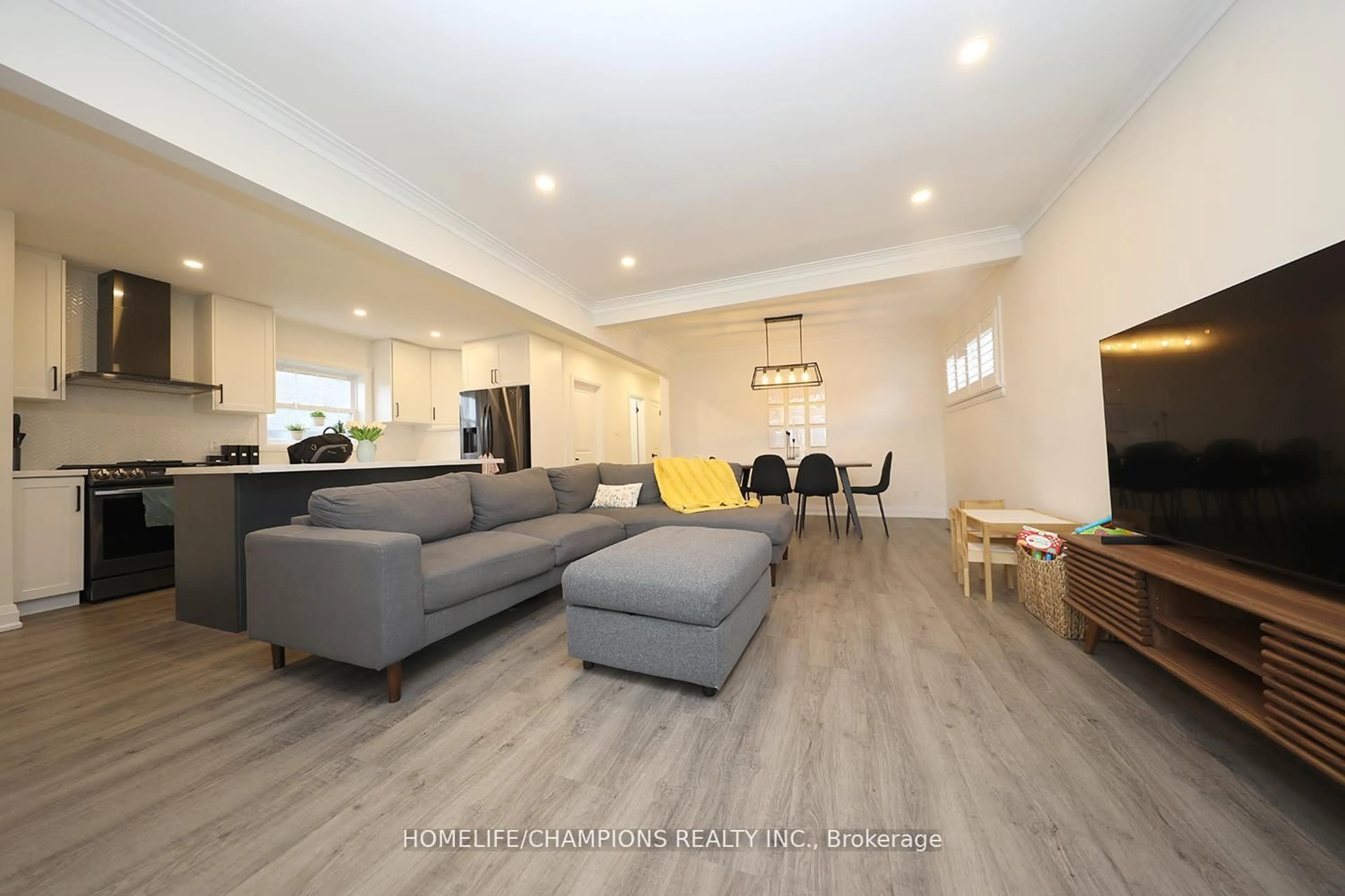 Living room with furniture, wood/laminate floor for 50 Fraserton Cres, Toronto Ontario M1J 1S8