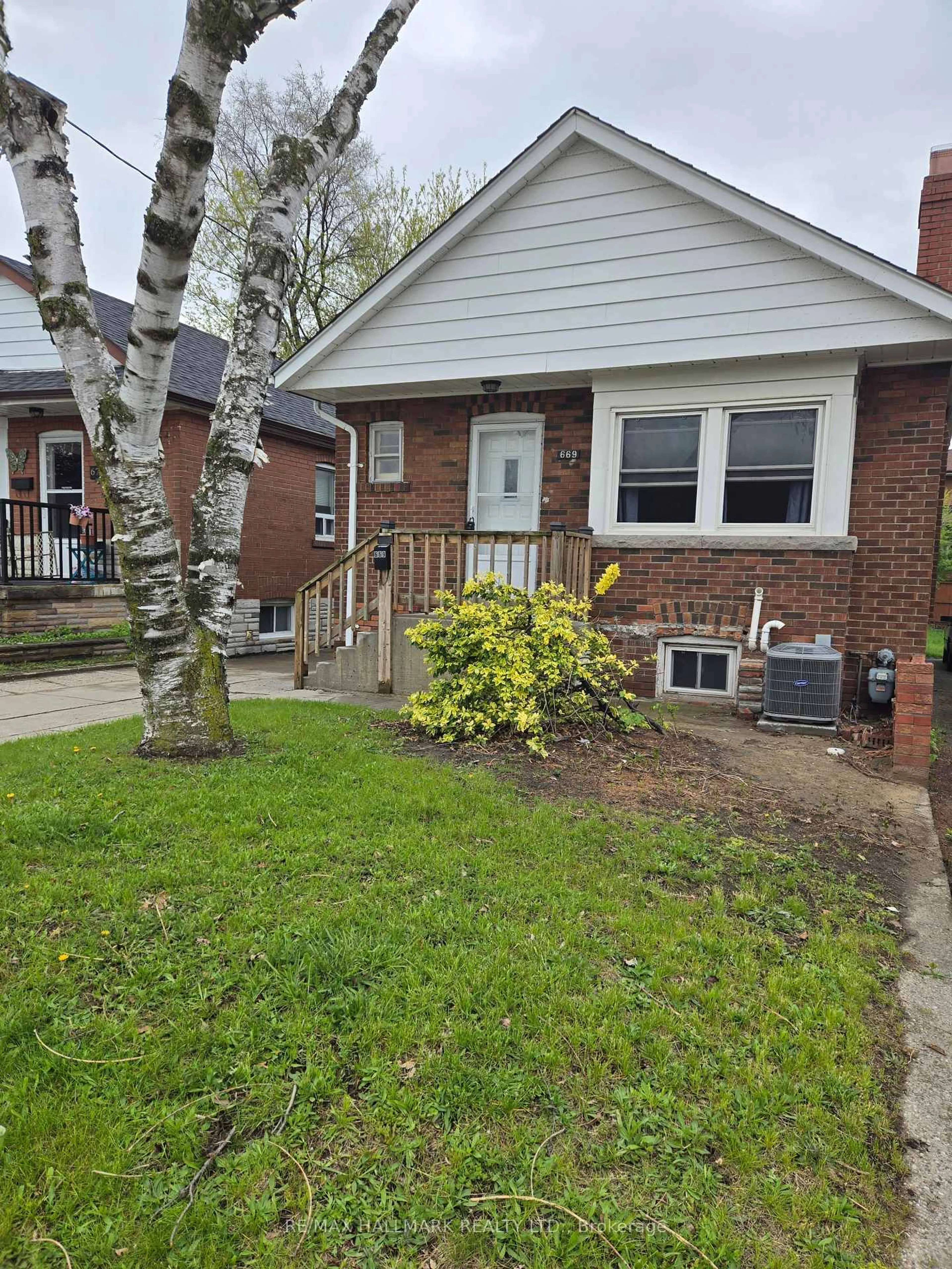 Home with brick exterior material, street for 669 Cosburn Ave, Toronto Ontario M4C 2V1