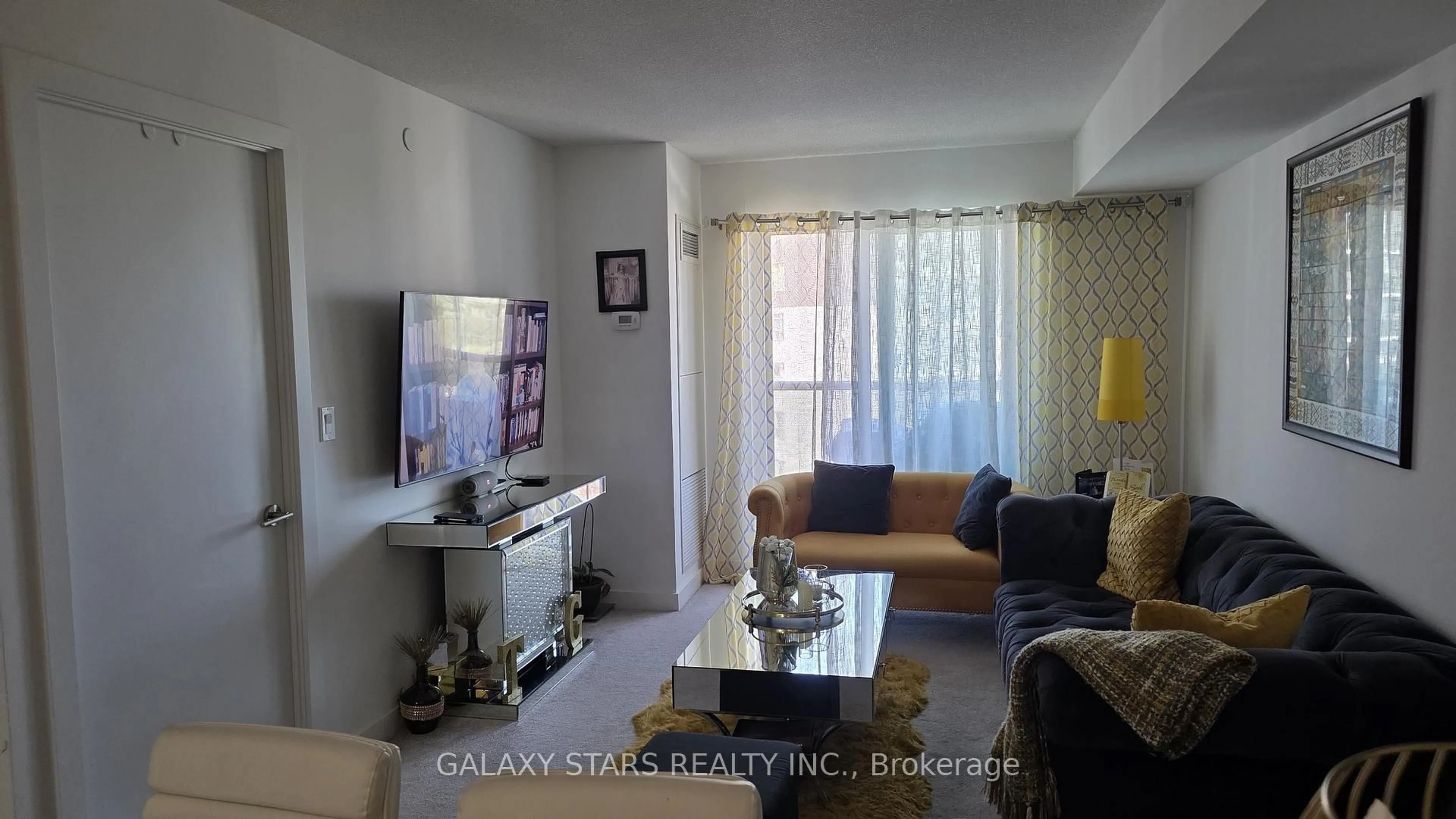 Living room with furniture, unknown for 1346 Danforth Rd #1117, Toronto Ontario M1J 0A9