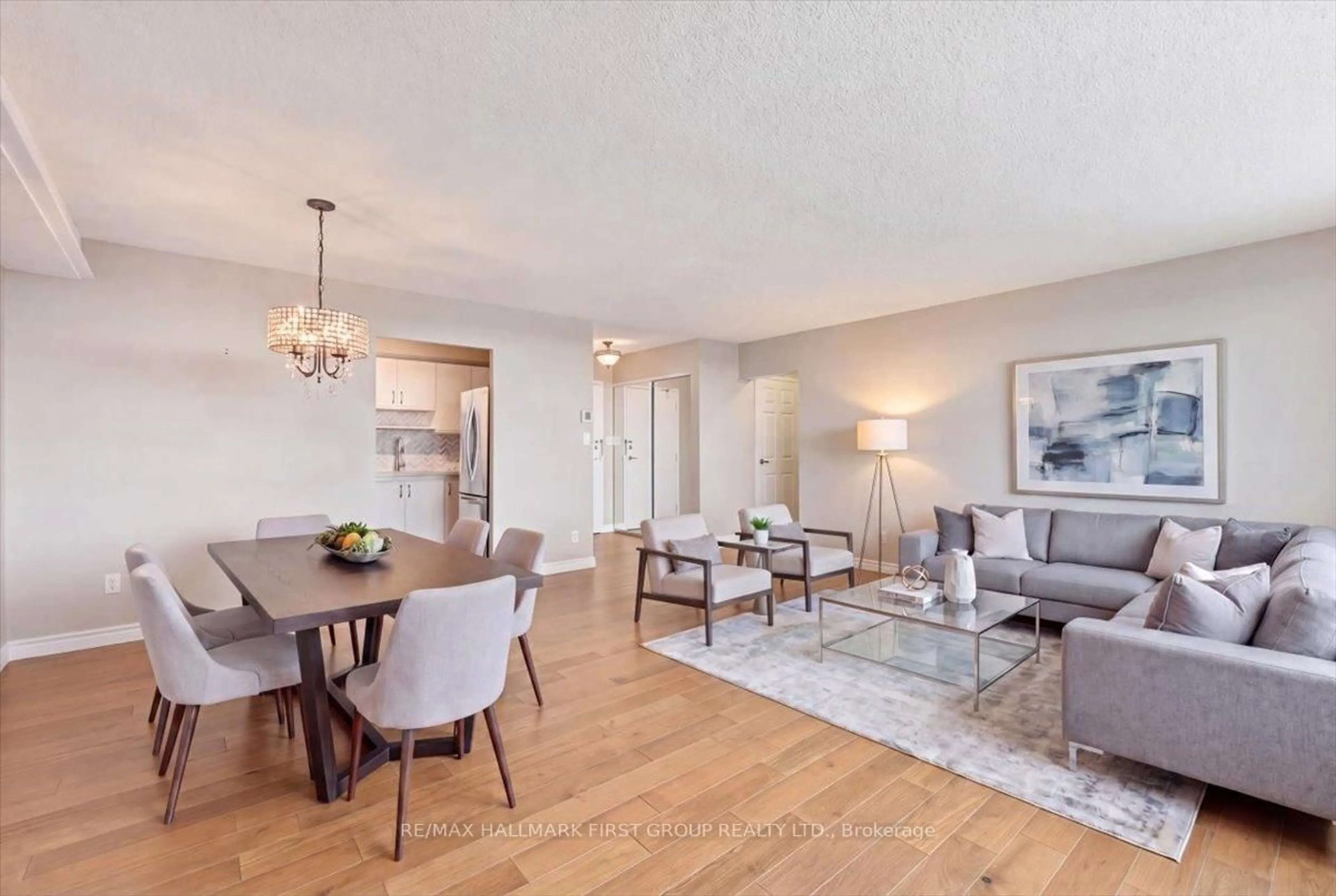 Living room with furniture, wood/laminate floor for 55 William St #PH14, Oshawa Ontario L1G 7C9