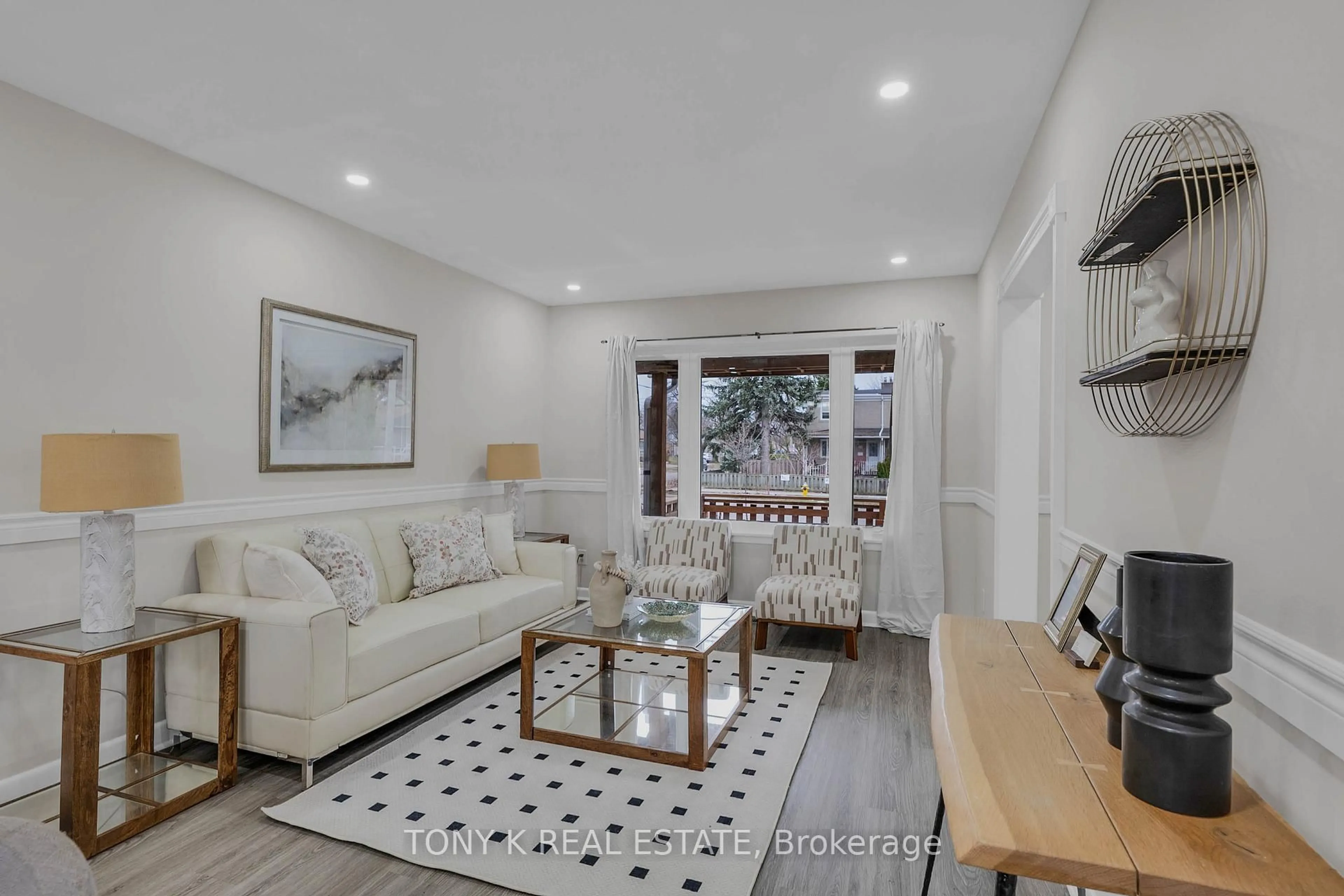 Living room with furniture, wood/laminate floor for 65 Clapperton Ave, Toronto Ontario M1L 4K7