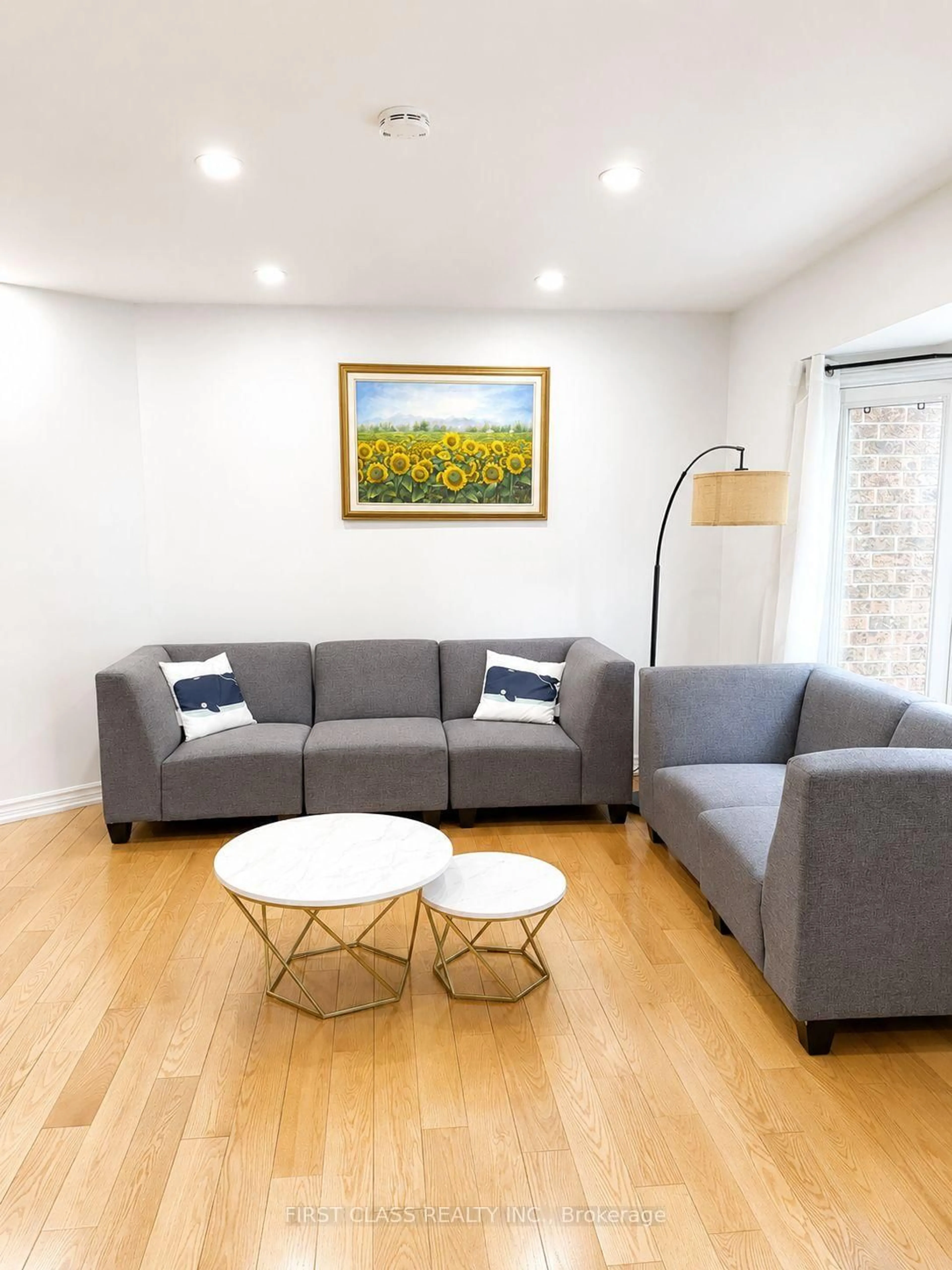 Living room with furniture, wood/laminate floor for 59 Calverley Tr, Toronto Ontario M1C 3S5