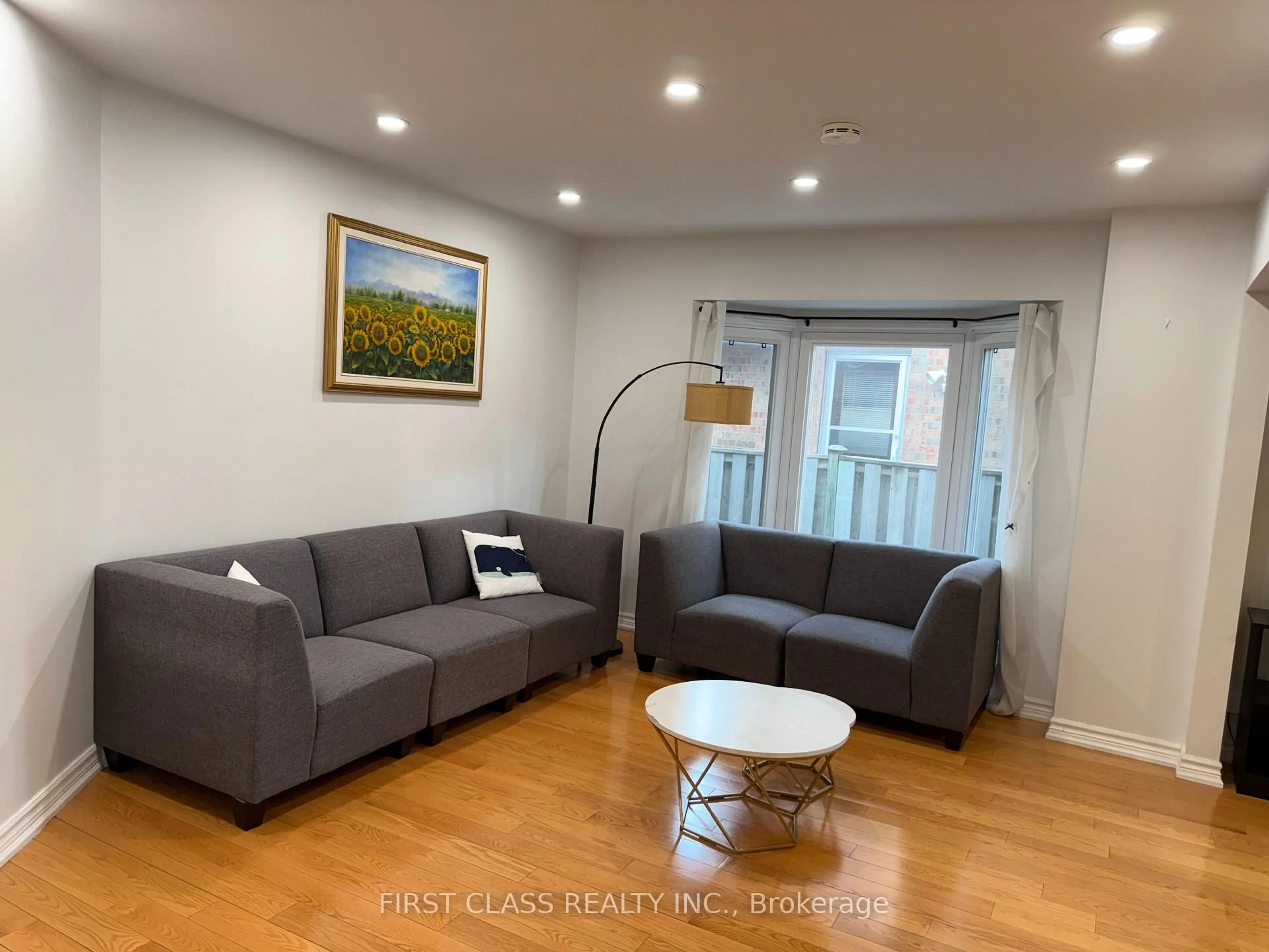 Living room with furniture, wood/laminate floor for 59 Calverley Tr, Toronto Ontario M1C 3S5