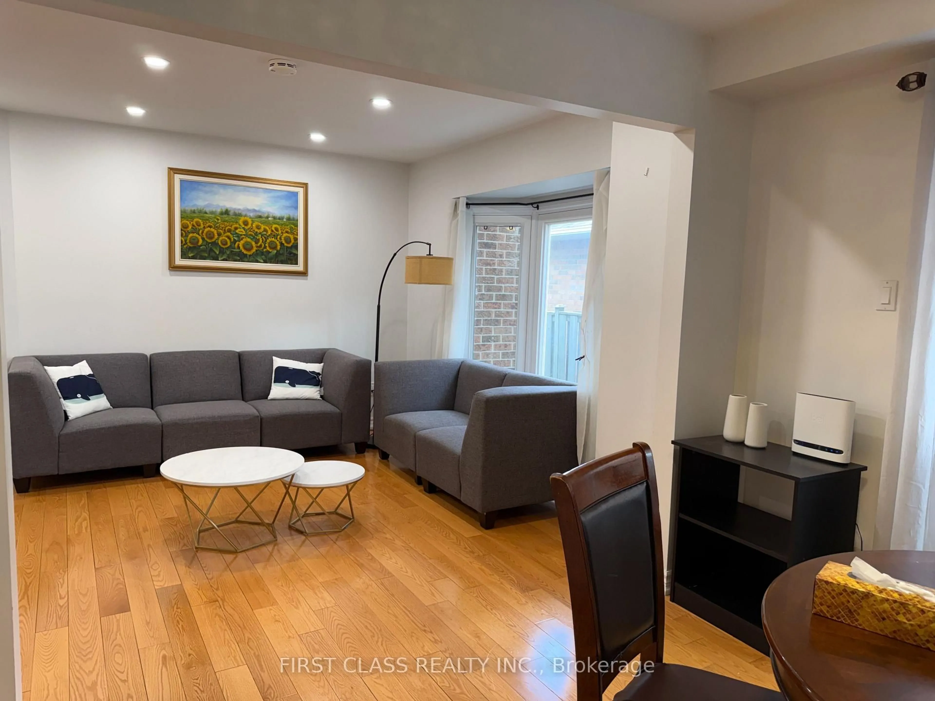 Living room with furniture, wood/laminate floor for 59 Calverley Tr, Toronto Ontario M1C 3S5