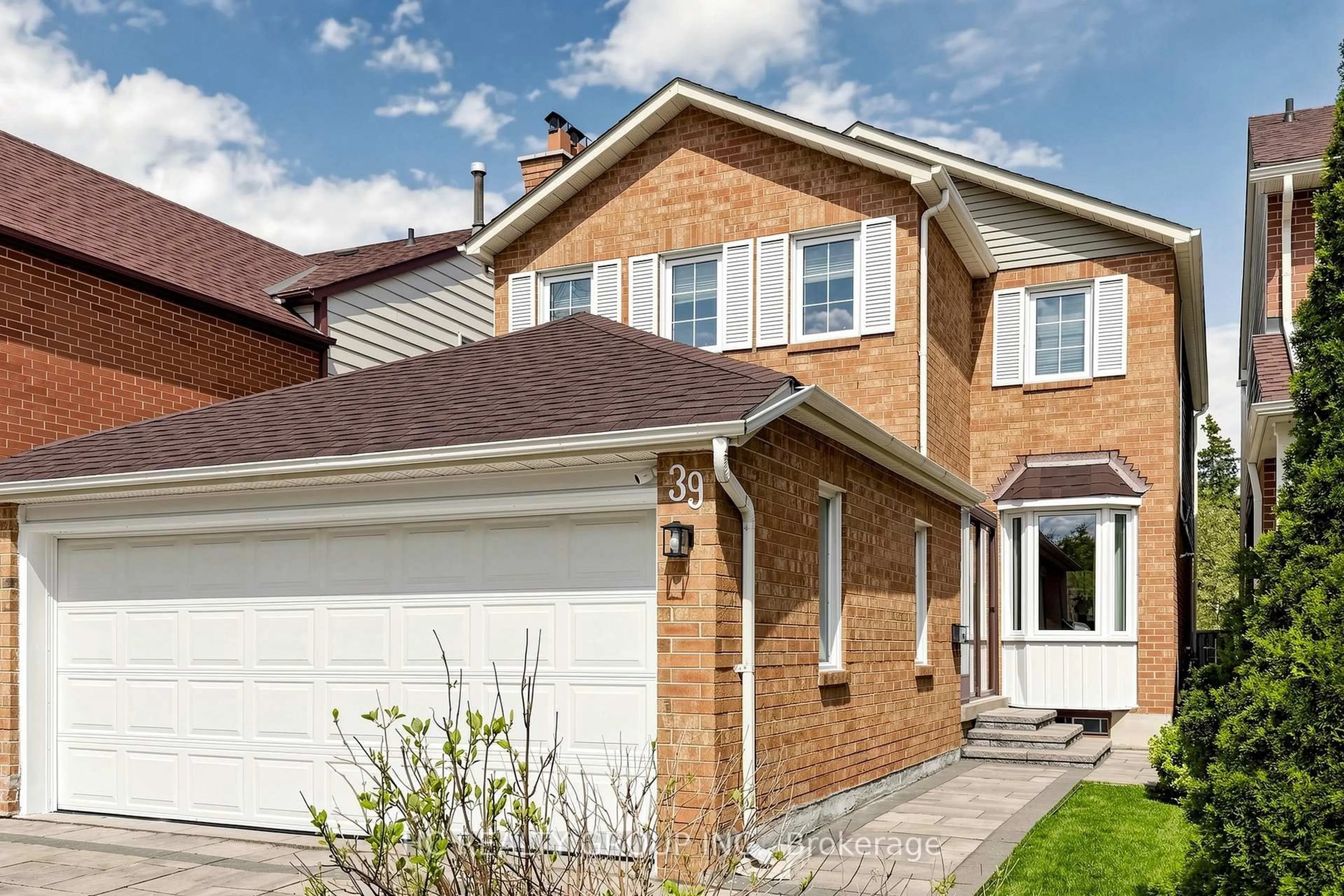 Home with brick exterior material, street for 39 River Grove Dr, Toronto Ontario M1W 3T8