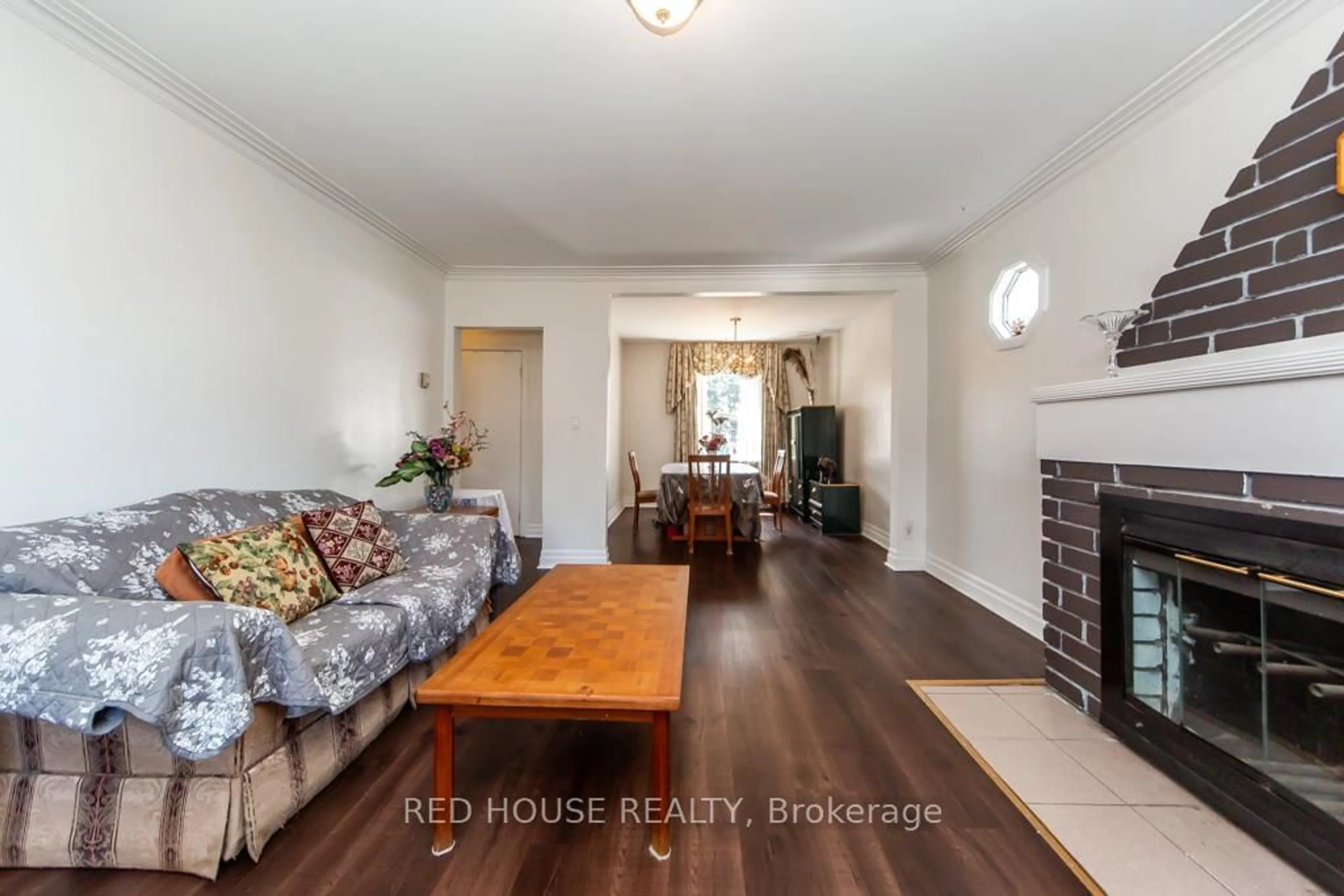 Living room with furniture, wood/laminate floor for 40 North Woodrow Blvd, Toronto Ontario M1K 1W3