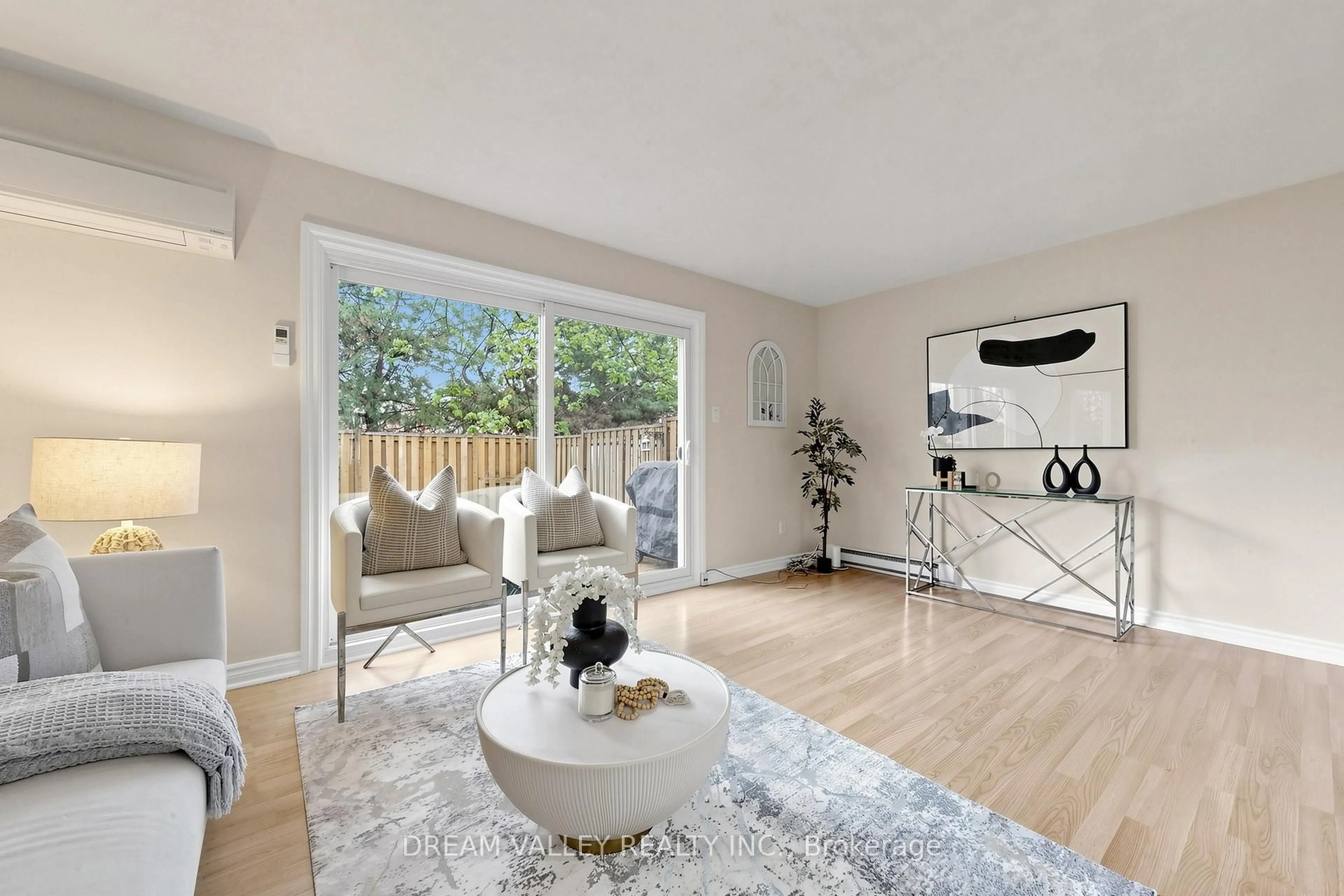 Living room with furniture, wood/laminate floor for 2075 Warden Ave #62, Toronto Ontario M1T 3R1