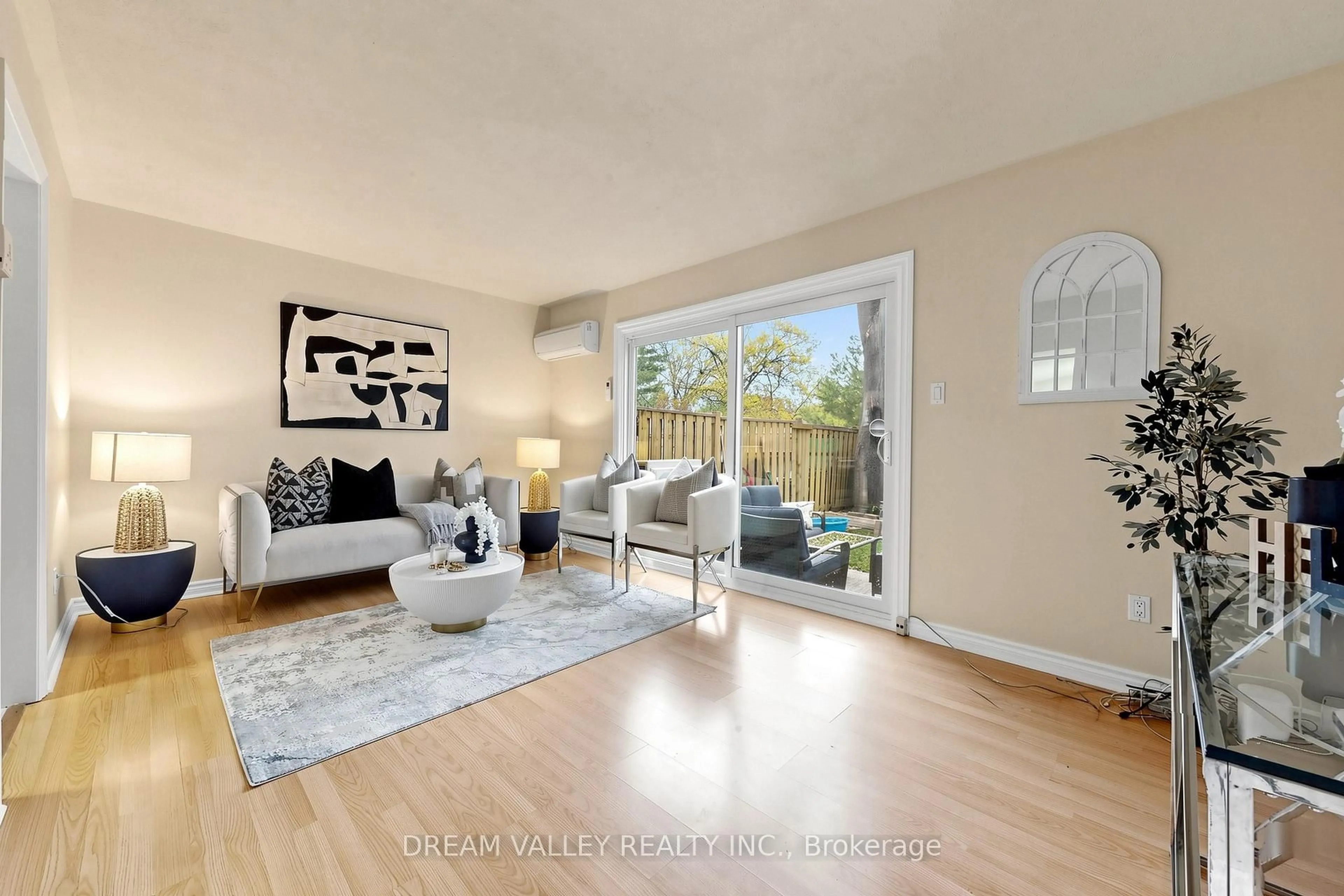Living room with furniture, wood/laminate floor for 2075 Warden Ave #62, Toronto Ontario M1T 3R1