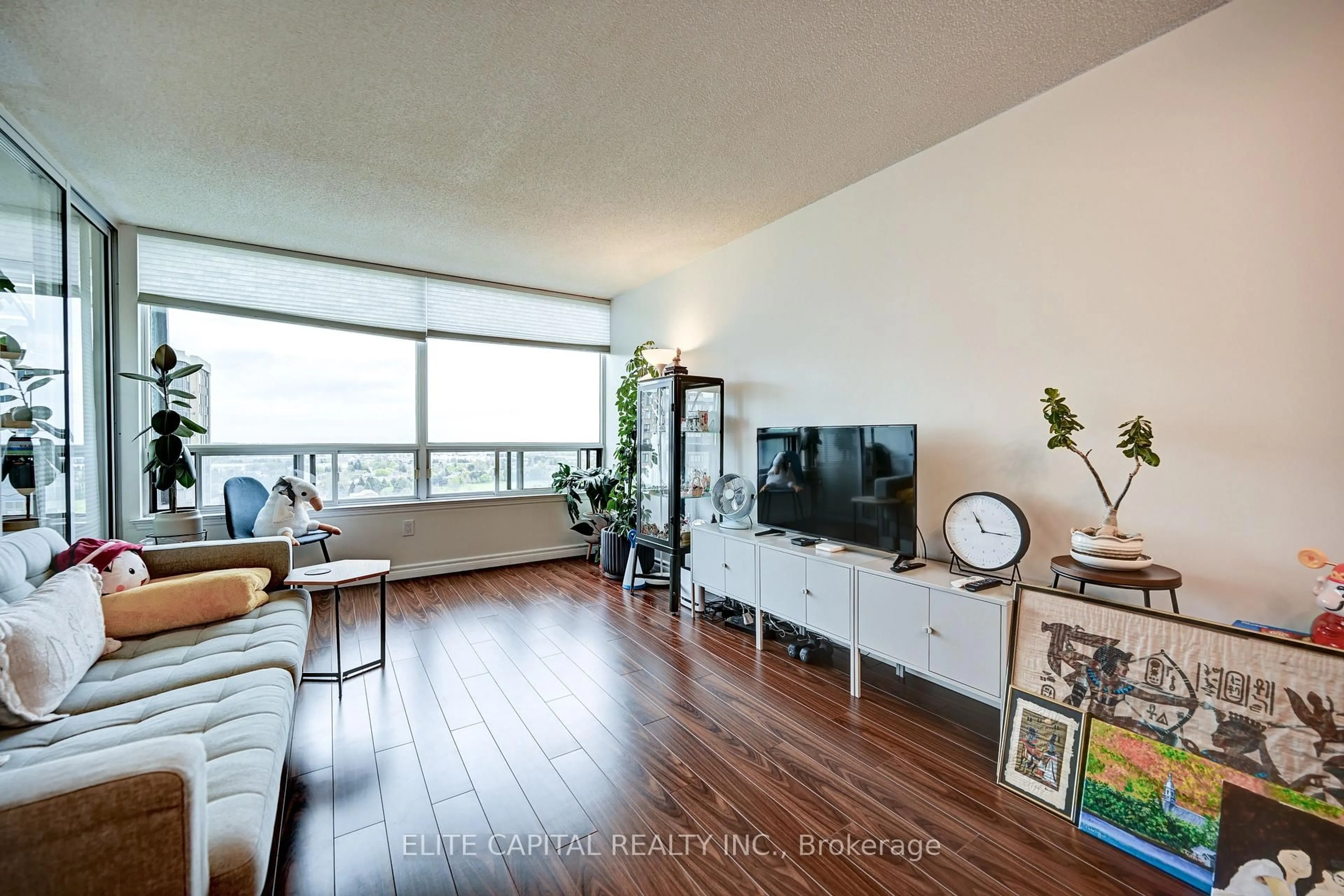Living room with furniture, wood/laminate floor for 350 Alton Towers Circ #1706, Toronto Ontario M1V 5E3