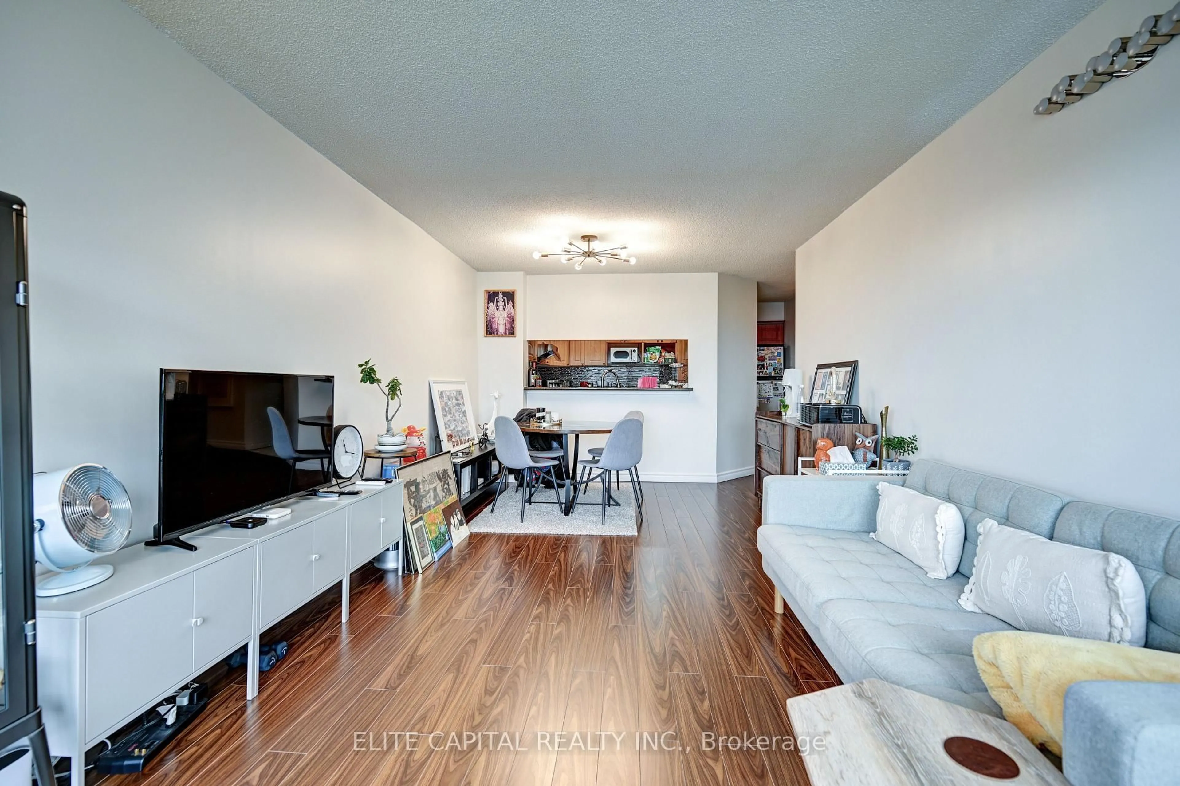 Living room with furniture, wood/laminate floor for 350 Alton Towers Circ #1706, Toronto Ontario M1V 5E3