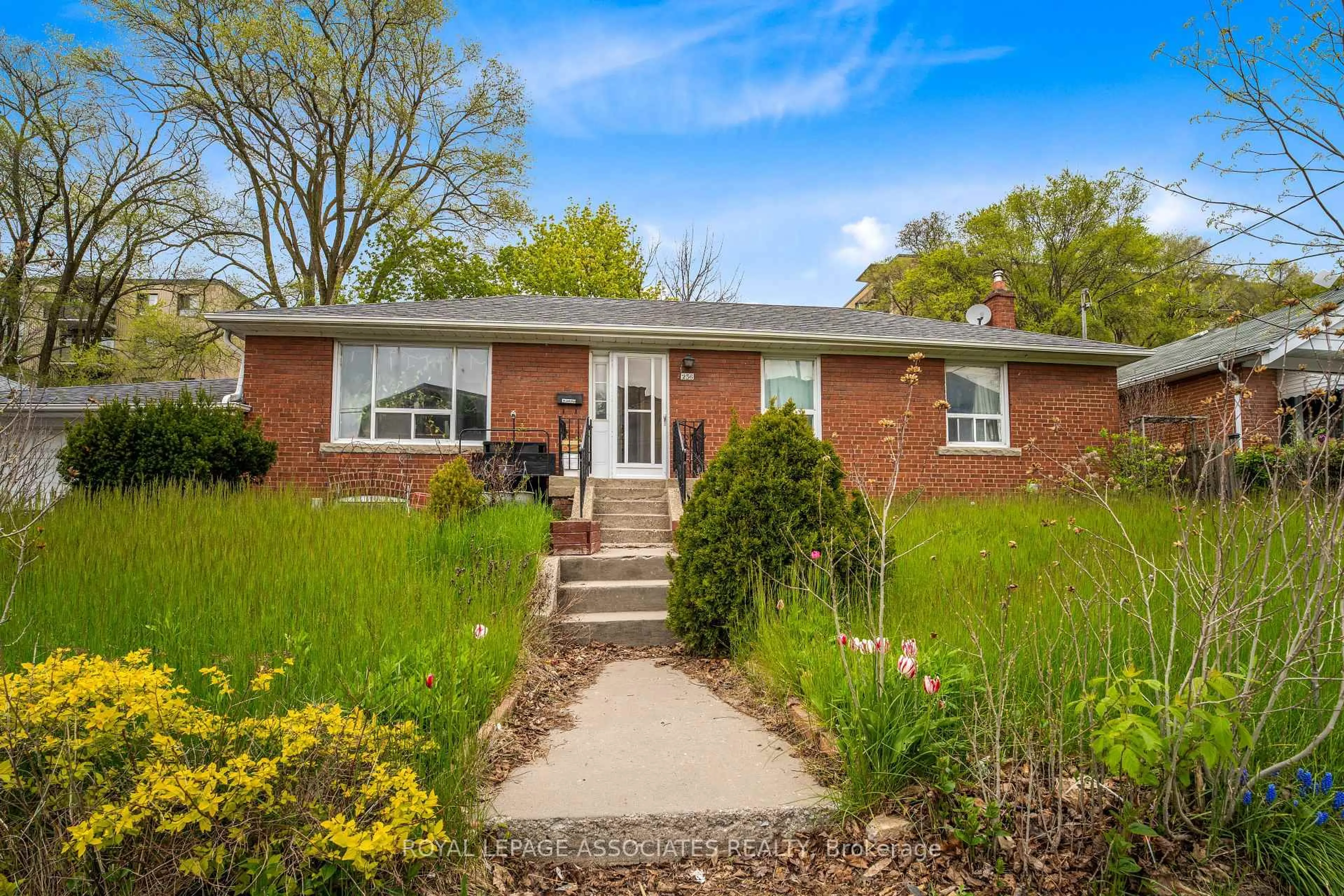 Home with brick exterior material, street for 256 Ferris Rd, Toronto Ontario M4B 1H6