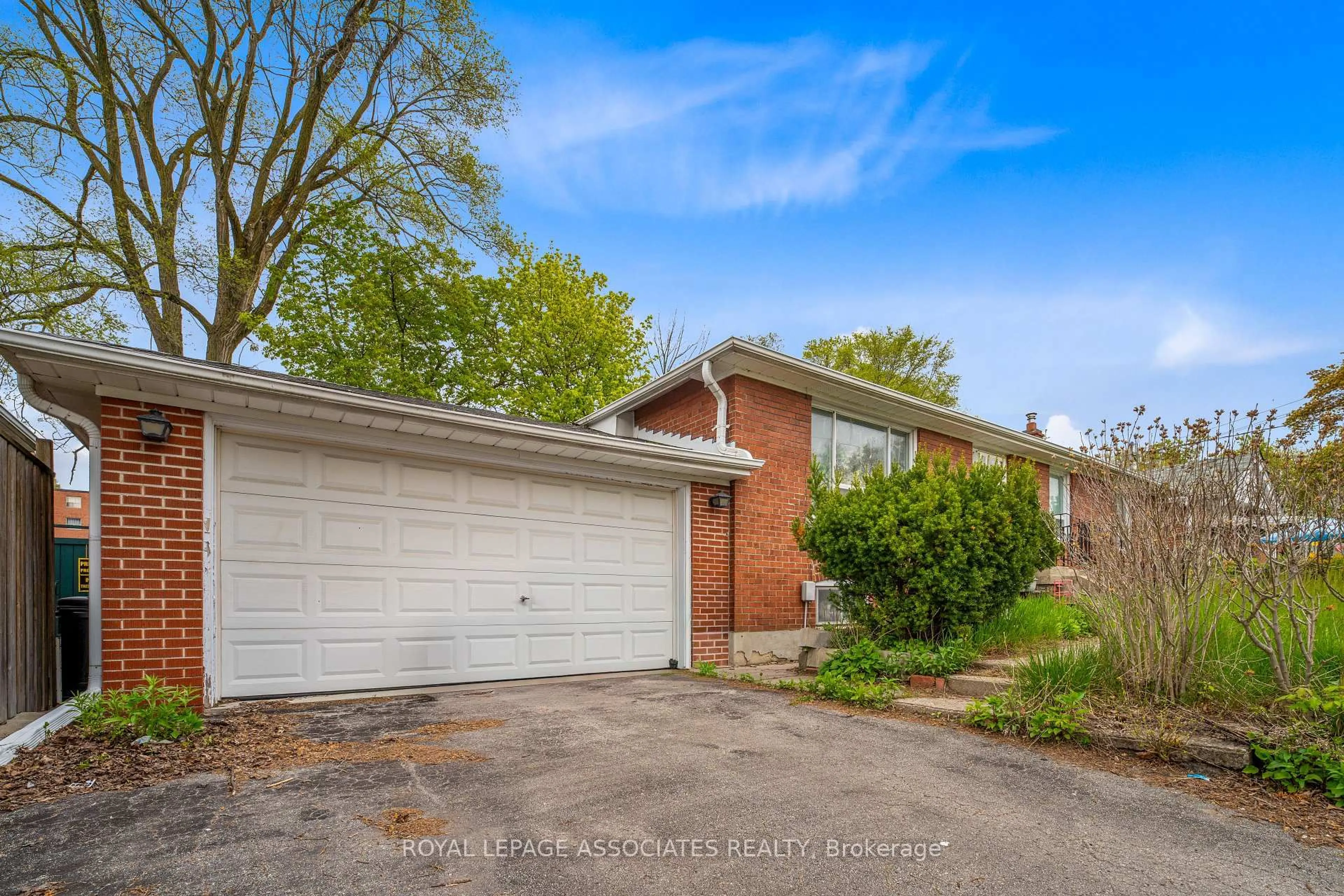 Home with brick exterior material, street for 256 Ferris Rd, Toronto Ontario M4B 1H6
