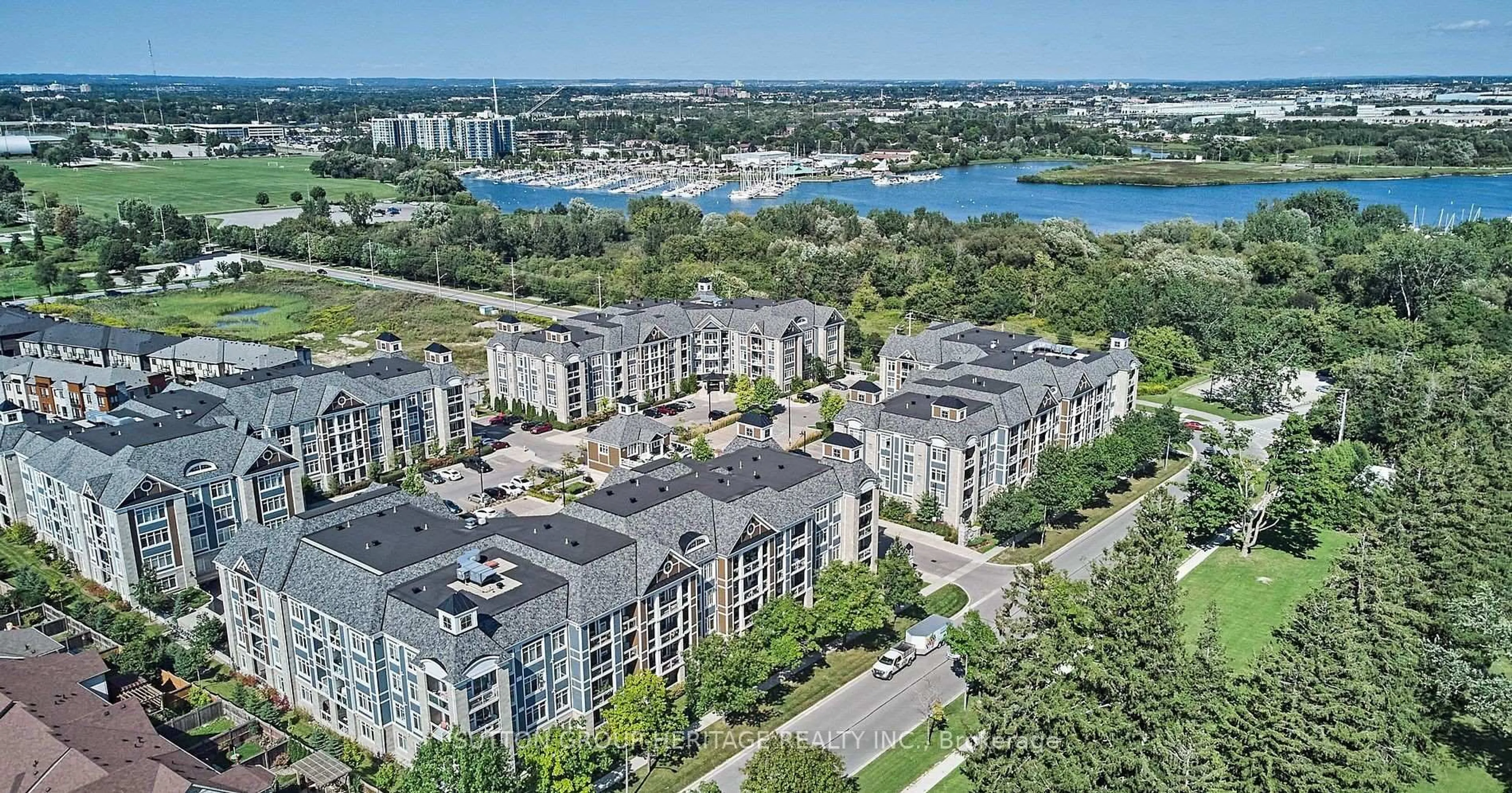 A pic from outside/outdoor area/front of a property/back of a property/a pic from drone, city buildings view from balcony for 660 Gordon St #201, Whitby Ontario L1N 0L1